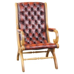 Luxurious and classic red flame-grained English leather chesterfield armchair