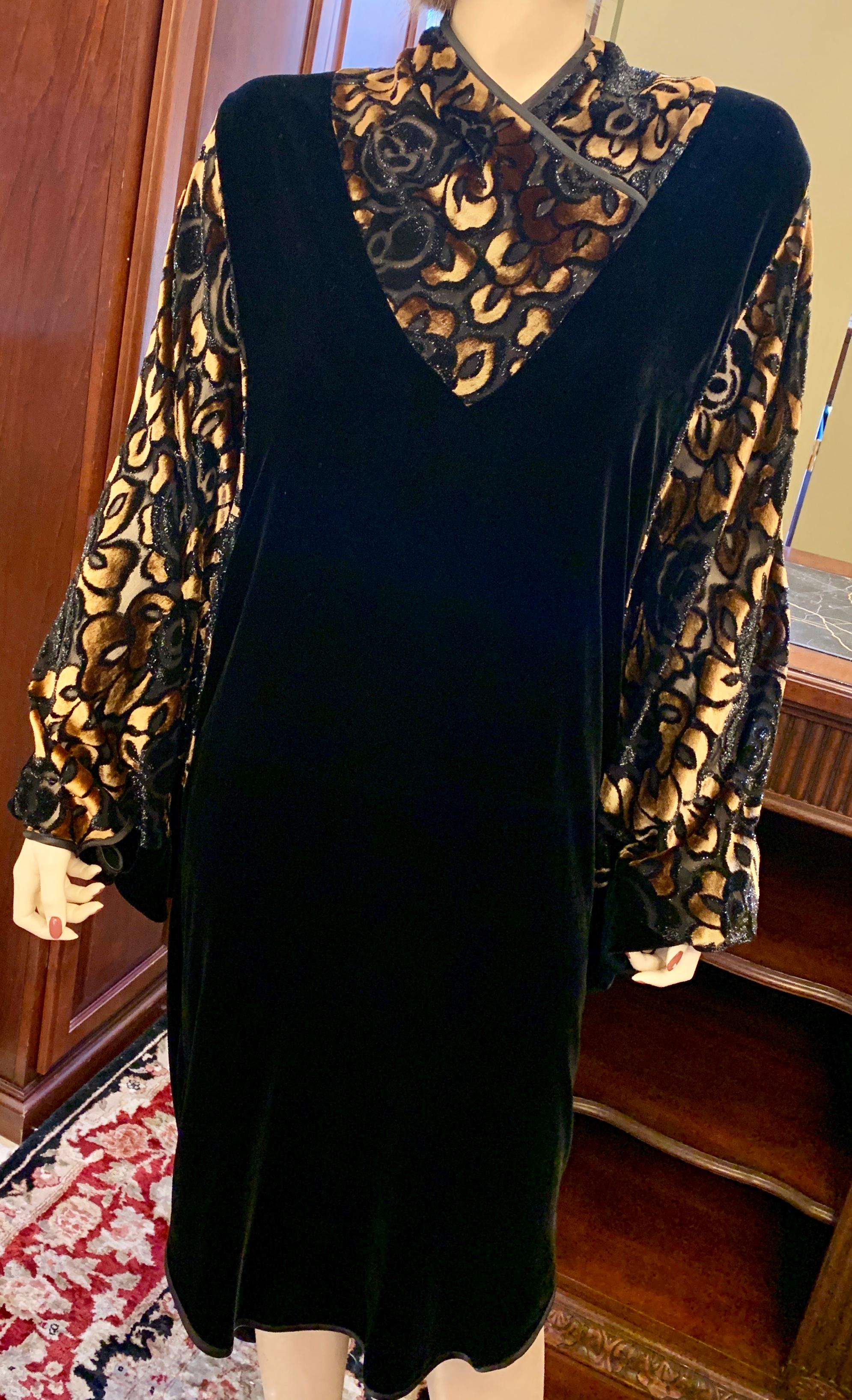 Dramatic, 1920s Art Deco inspired, long sleeved black silk velvet cocoon dress is a timeless classic!  Cocoon dress features a large open shape, with the long sleeves and top “V” shaped patterns of voided silk embellished with gold and iridescent