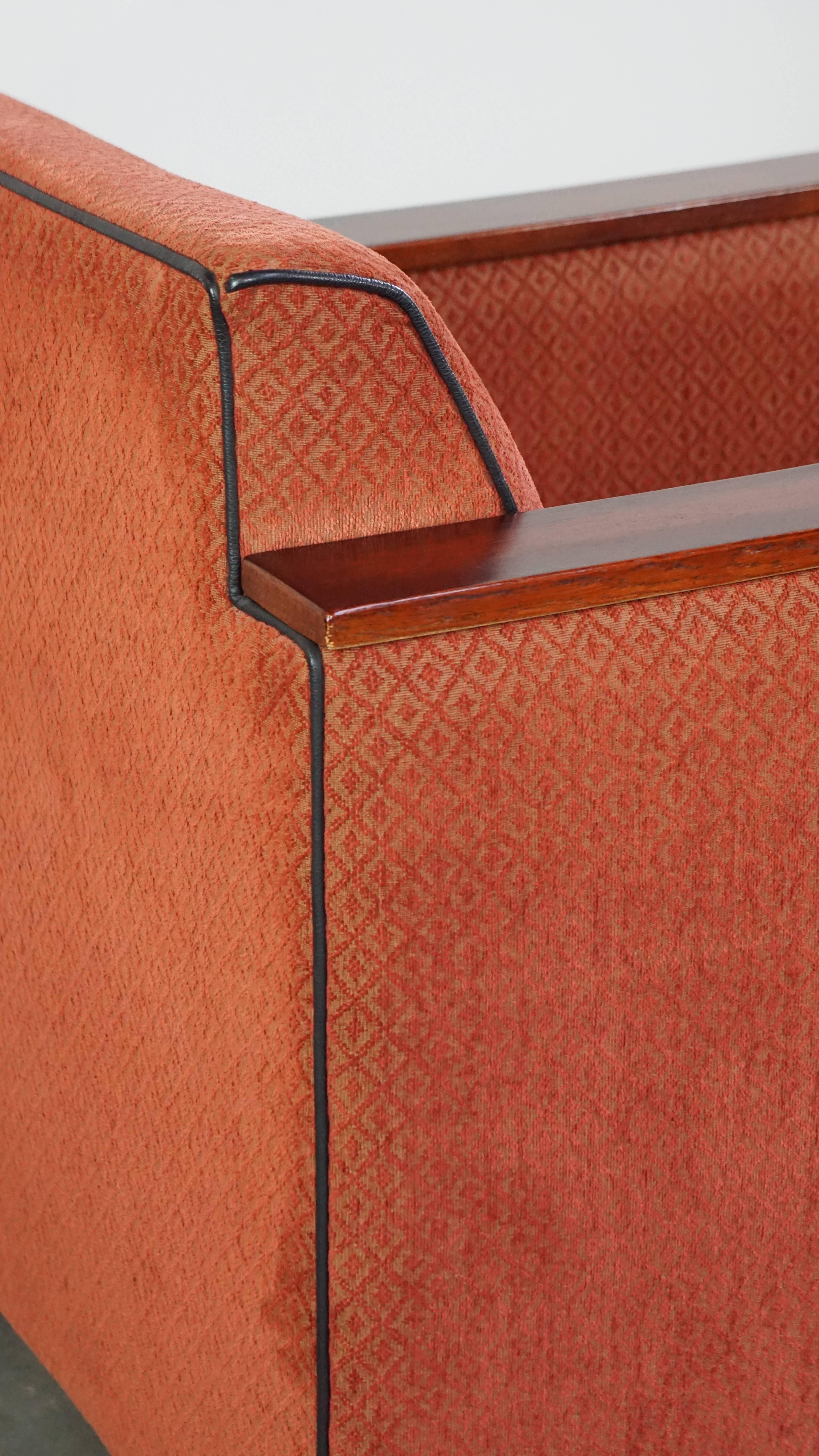 Luxurious Art Deco design armchair with red fabric upholstery and wooden details For Sale 5
