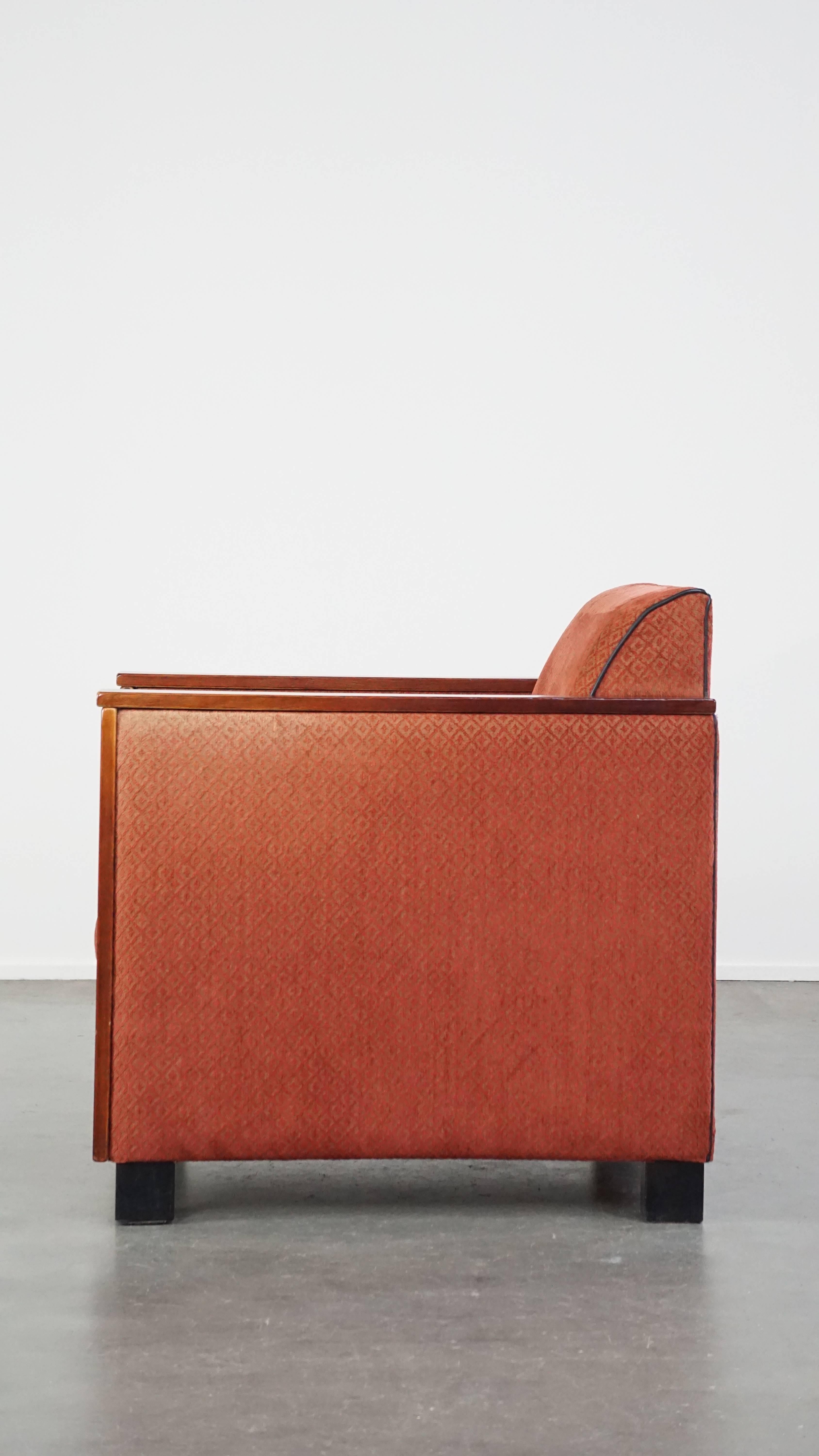 20th Century Luxurious Art Deco design armchair with red fabric upholstery and wooden details For Sale