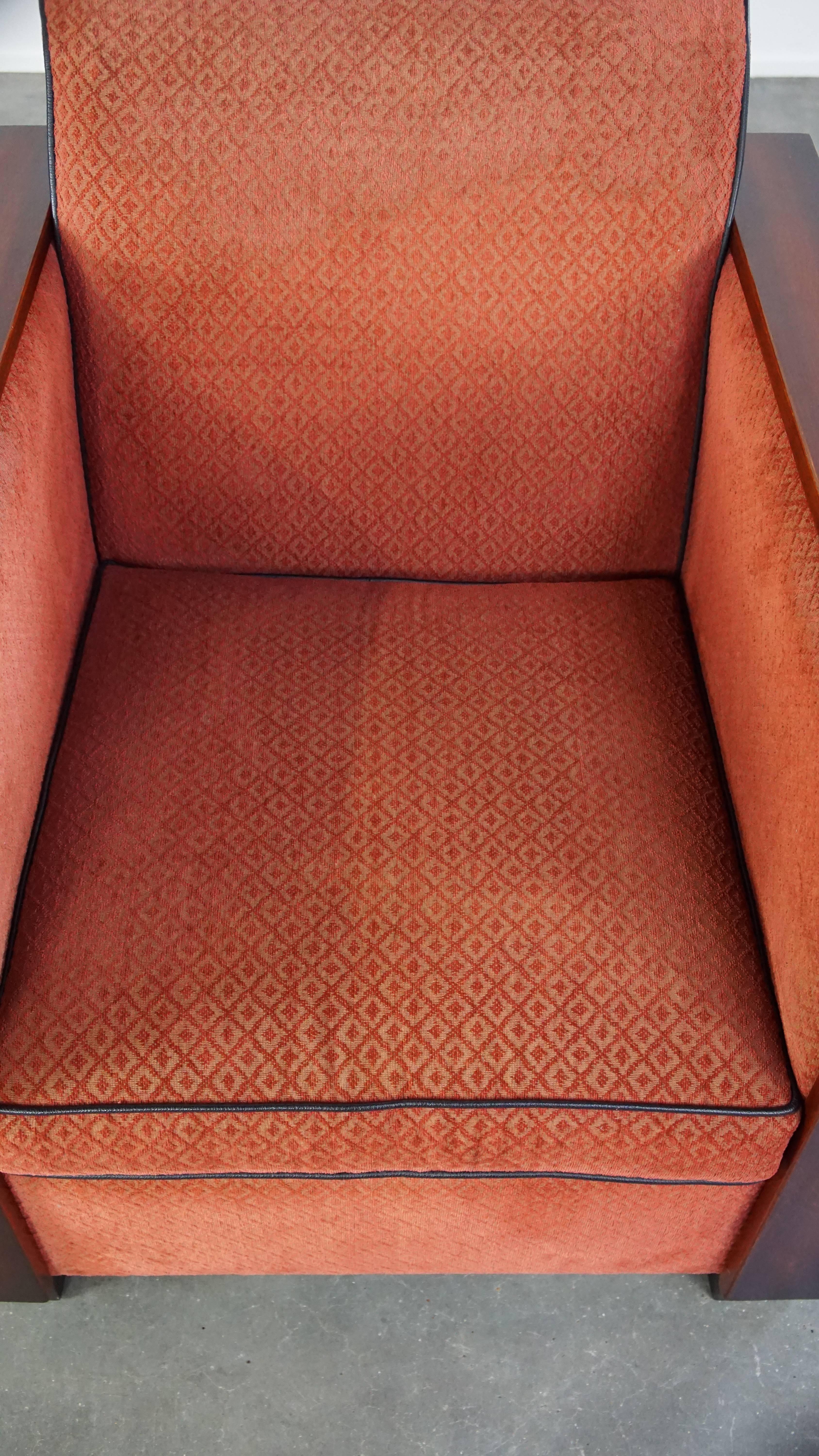 Fabric Luxurious Art Deco design armchair with red fabric upholstery and wooden details For Sale