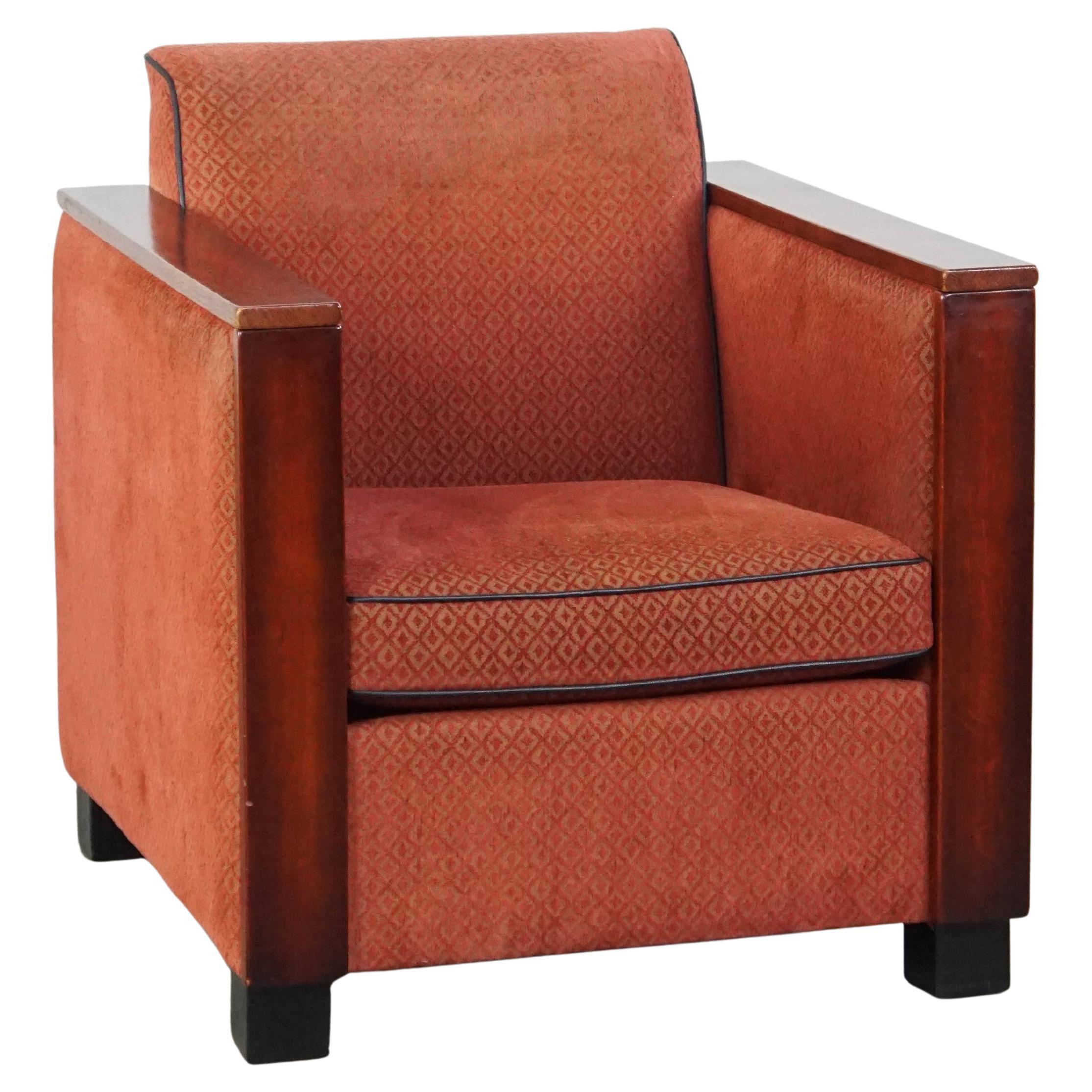 Luxurious Art Deco design armchair with red fabric upholstery and wooden details