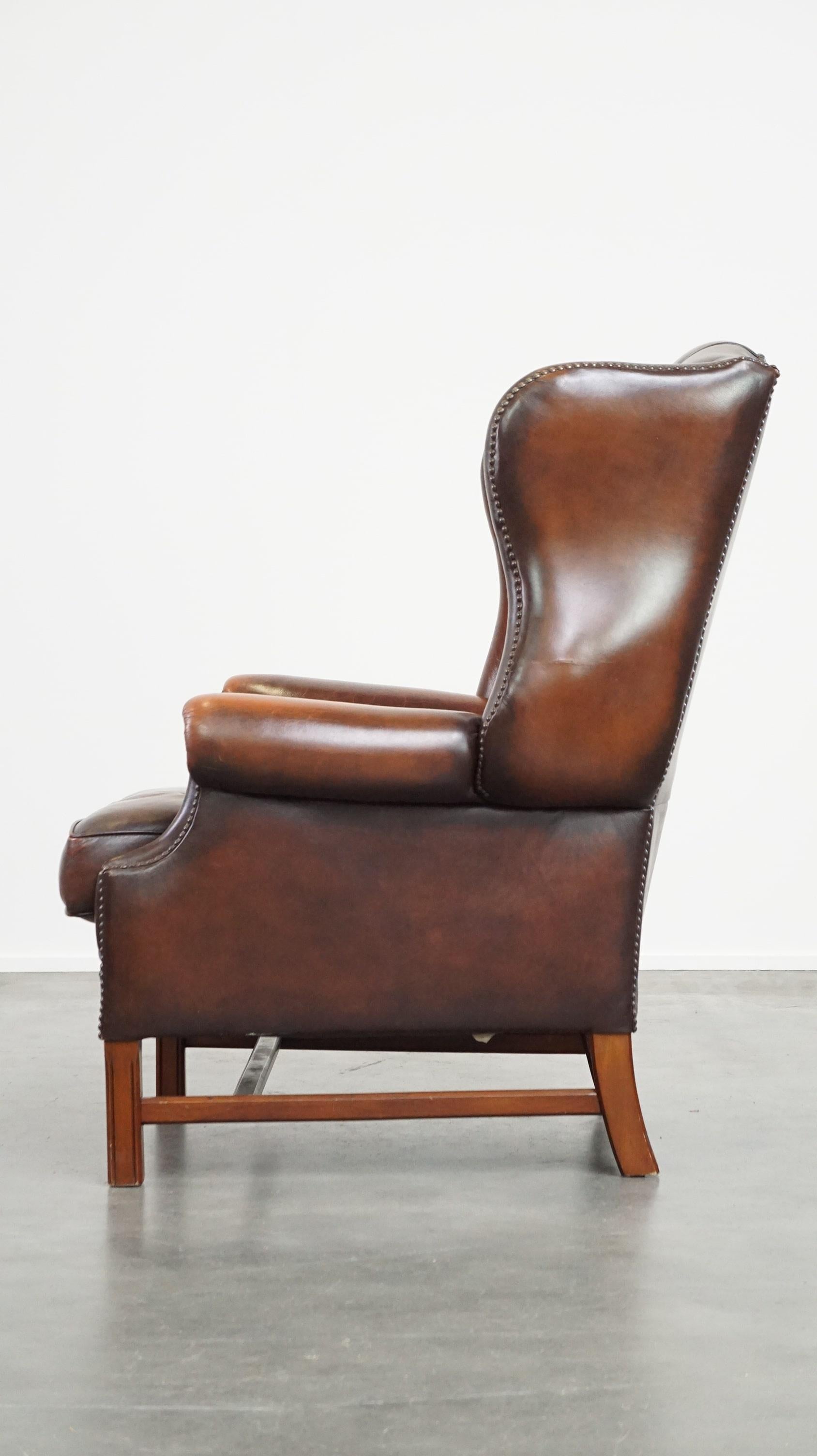 Hand-Crafted Luxurious brown leather chesterfield armchair finished with decorative nails For Sale