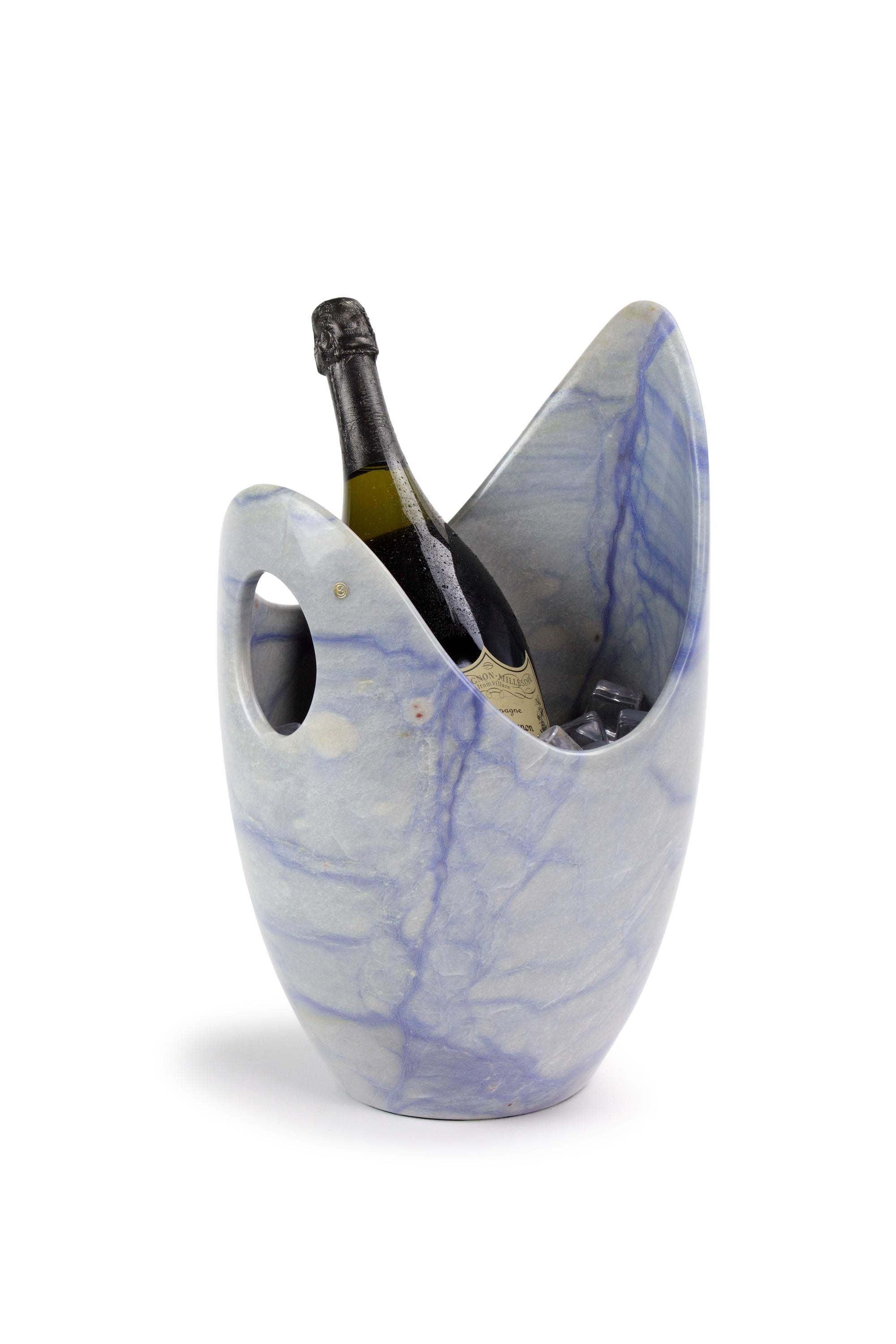 Luxurious and big Champagne bucket sculpted by hand from a solid block of Azul Macaubas. Polished finishing. 

Champagne bucket dimensions: D 26 x H 41 cm. Available in different quartzite, onyx and marbles. 

Limited edition of 50.

Each champagne