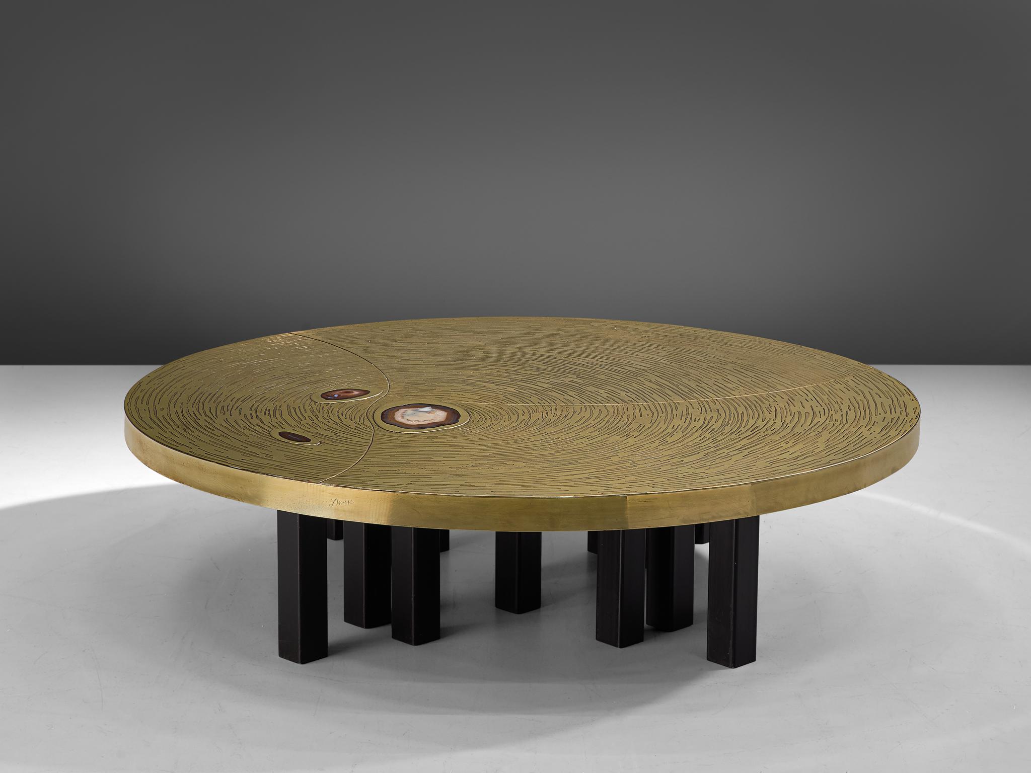 Jean Claude Dresse, coffee table, brass, steel and agate, Belgium, circa 1970.

A luxurious round cocktail table, crafted with high attention for detail which is characteristic for the work of the Belgian artist Jean Claude Dresse. The piece is