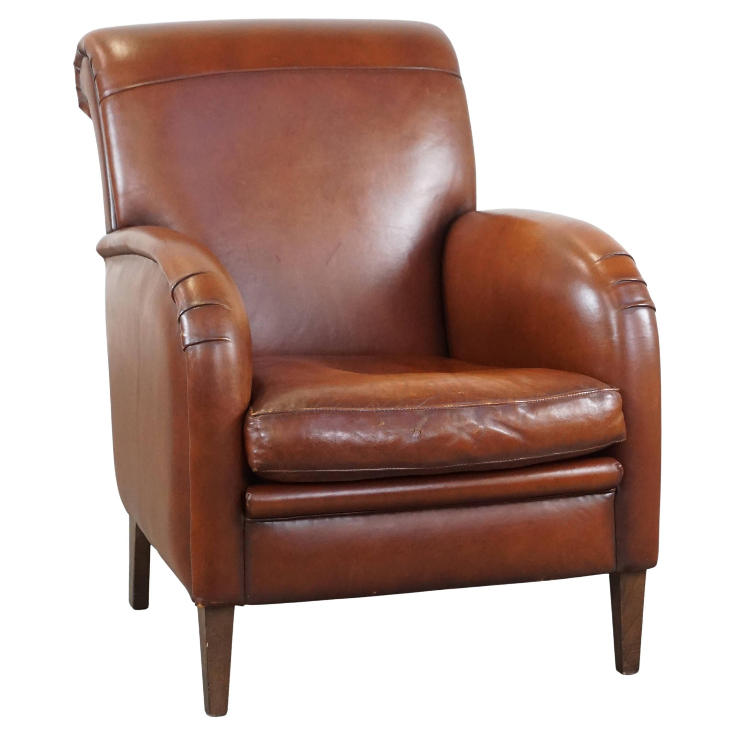 Luxurious cognac-colored sheepskin armchair with rounded shapes, unique design