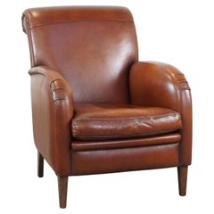 Luxurious cognac-colored sheepskin armchair with rounded shapes, unique design