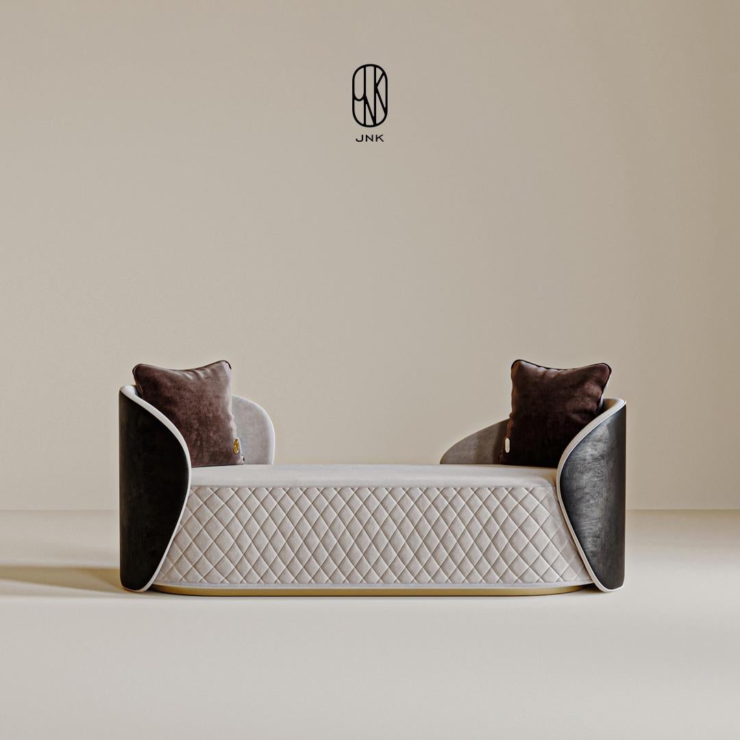 Banc Torres 

Elle présente un design moderne et sophistiqué. Les panneaux latéraux sont larges et arrondis, avec une surface sombre et texturée. Ces panneaux latéraux englobent la zone d'assise, créant ainsi une atmosphère confortable et