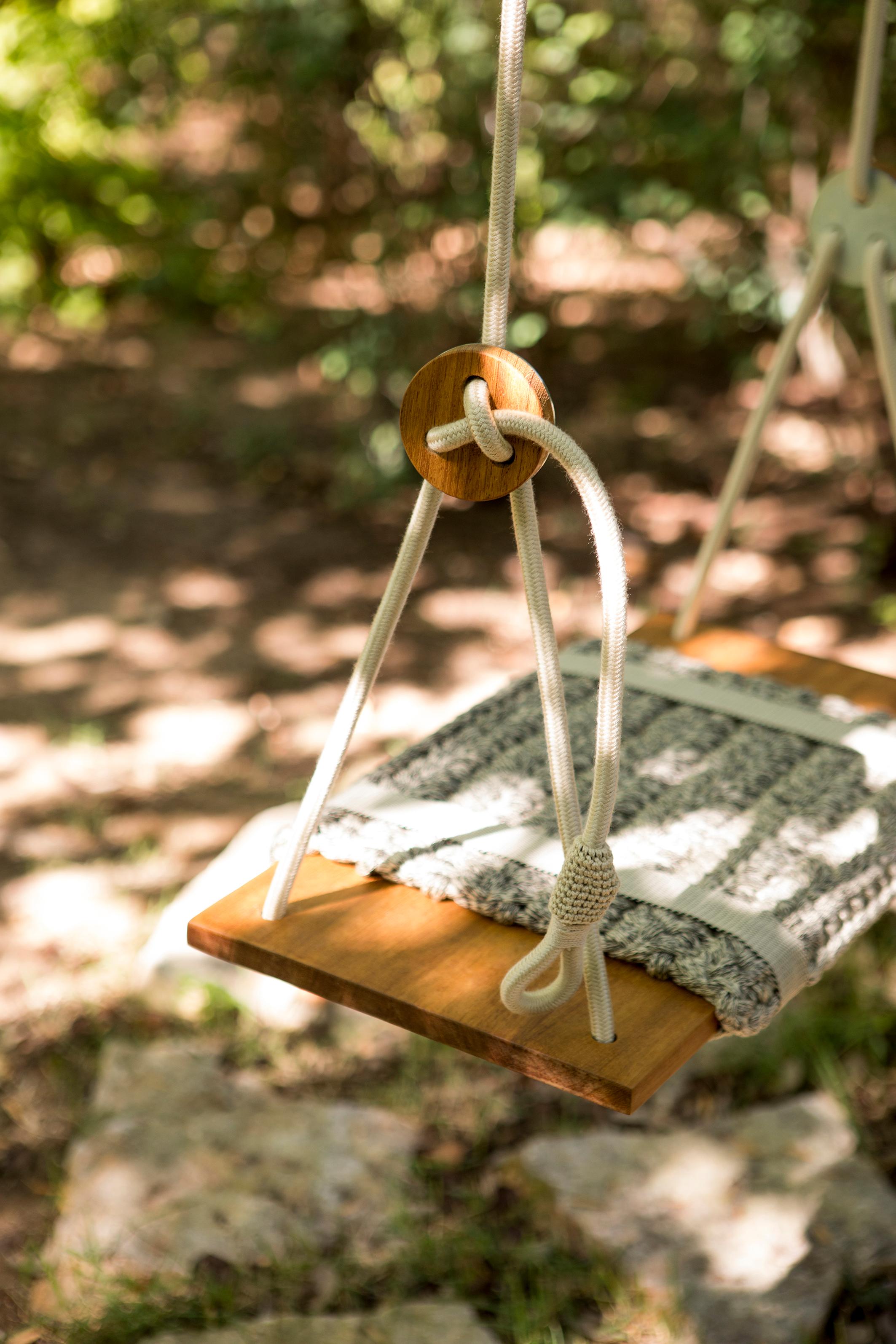 The iota rug swings are chic and minimalistic. They have a luxurious crochet rug covering a teak wood seat. The rugs are hand knit from exclusive iota bespoke yarn using UV protected acrylic and polyester making them suitable for the outdoors as