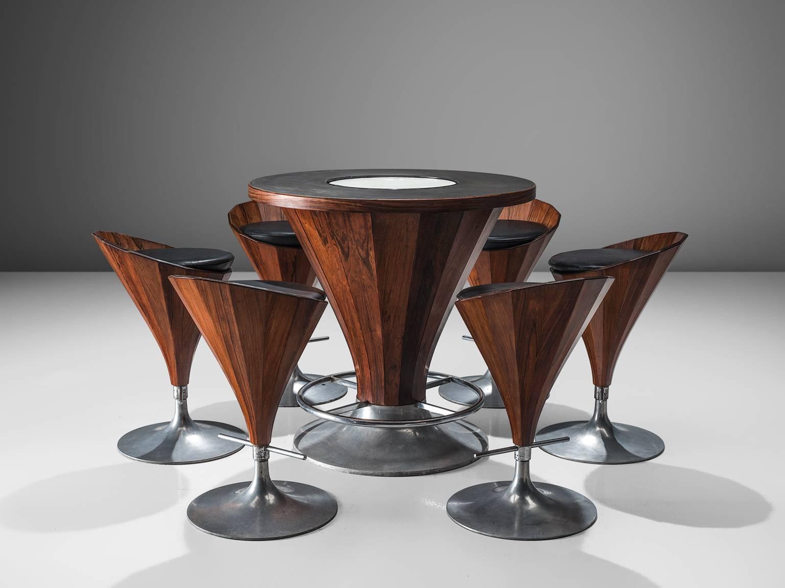 'Fountain' bar with set of six stools, rosewood and aluminum, Denmark, circa 1970

This high-quality conical table comes with six high chairs that are executed with strips of rosewood. The top of the table has a black and white formica inlay. The