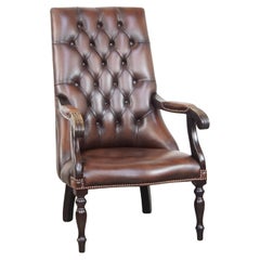 Luxurious dark English cowhide leather and wooden chesterfield armchair