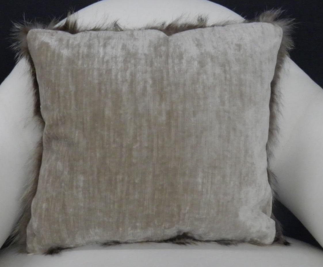 Luxurious down filled genuine Raccoon throw pillows. The furs have been fully refreshed are in great condition and filled with 50/50 down/down feathers. The backs are finished in a custom silk velvet. The pillows come in both 14