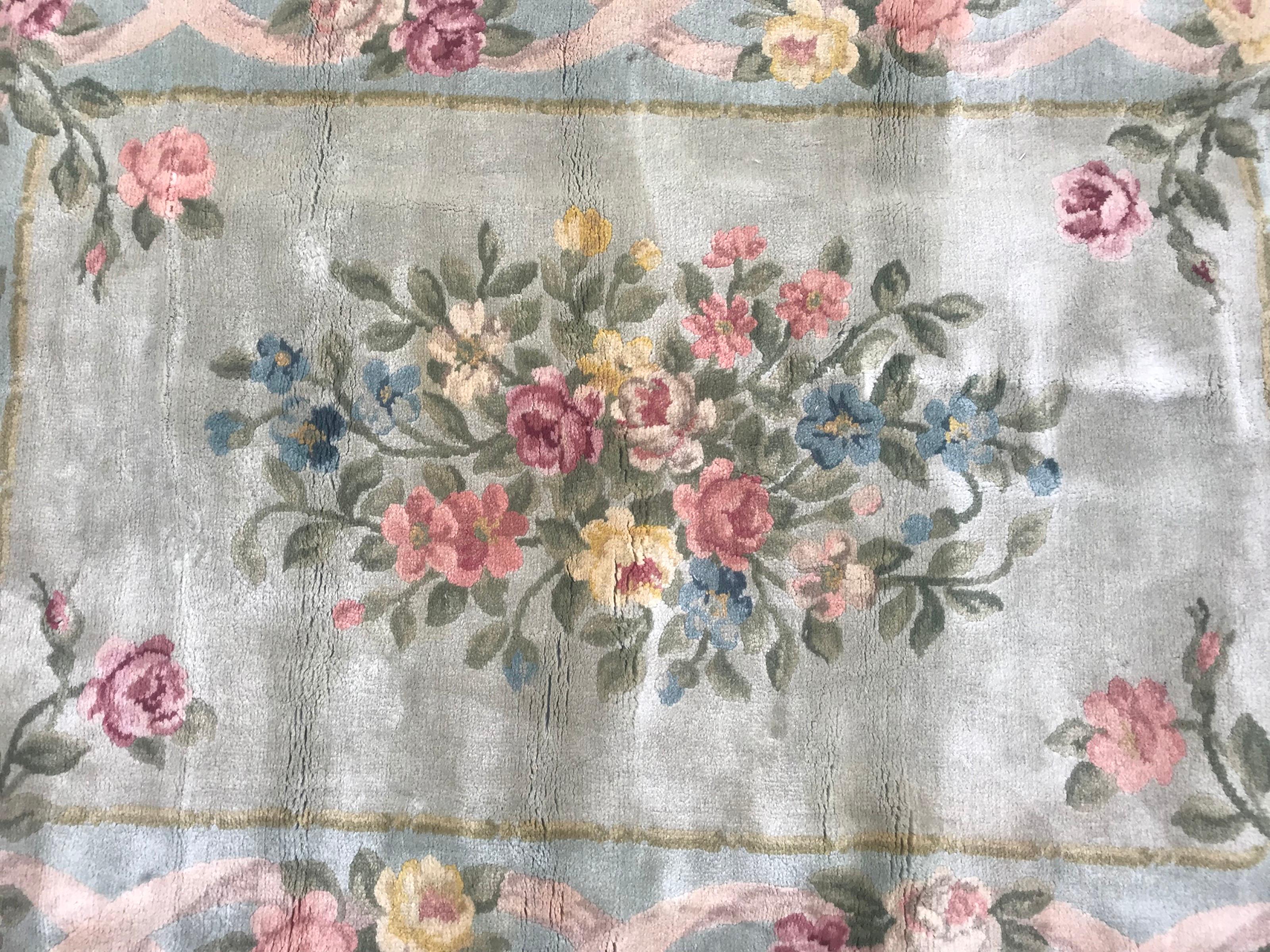 Very fine and beautiful early 20th century Aubusson knotted rug with nice floral design and beautiful colors with light green field, pink, orange, blue, yellow, purple and green colors, entirely hand knotted with wool velvet on cotton foundation.