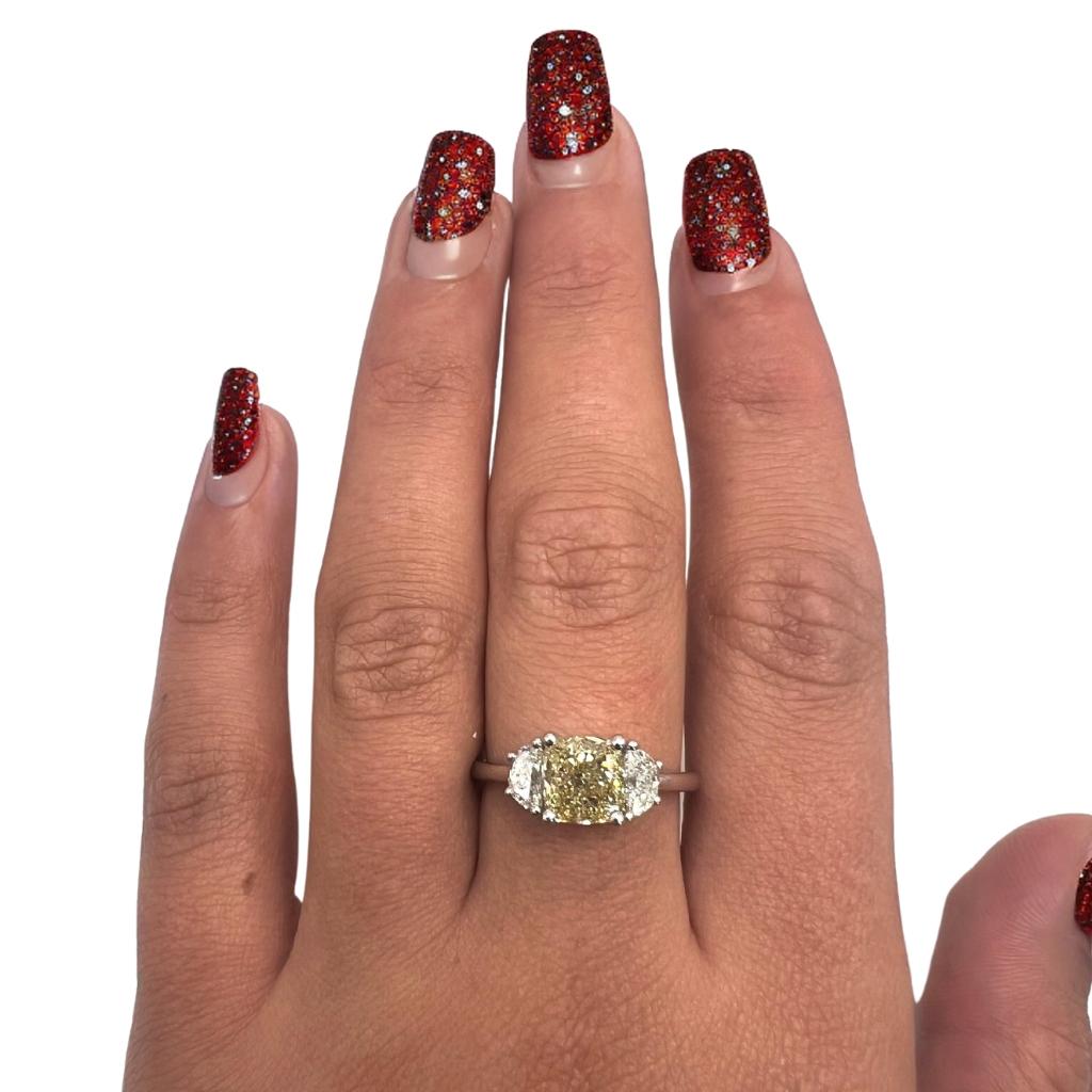 Stunning ring with extremely beautiful yellow Natural Diamond with brownish touch
the center diamond weight is 1.51 carat weight with the 2 half moons diamonds on the side its a real master piece. 
the all ring made from 18k white gold with 2.01