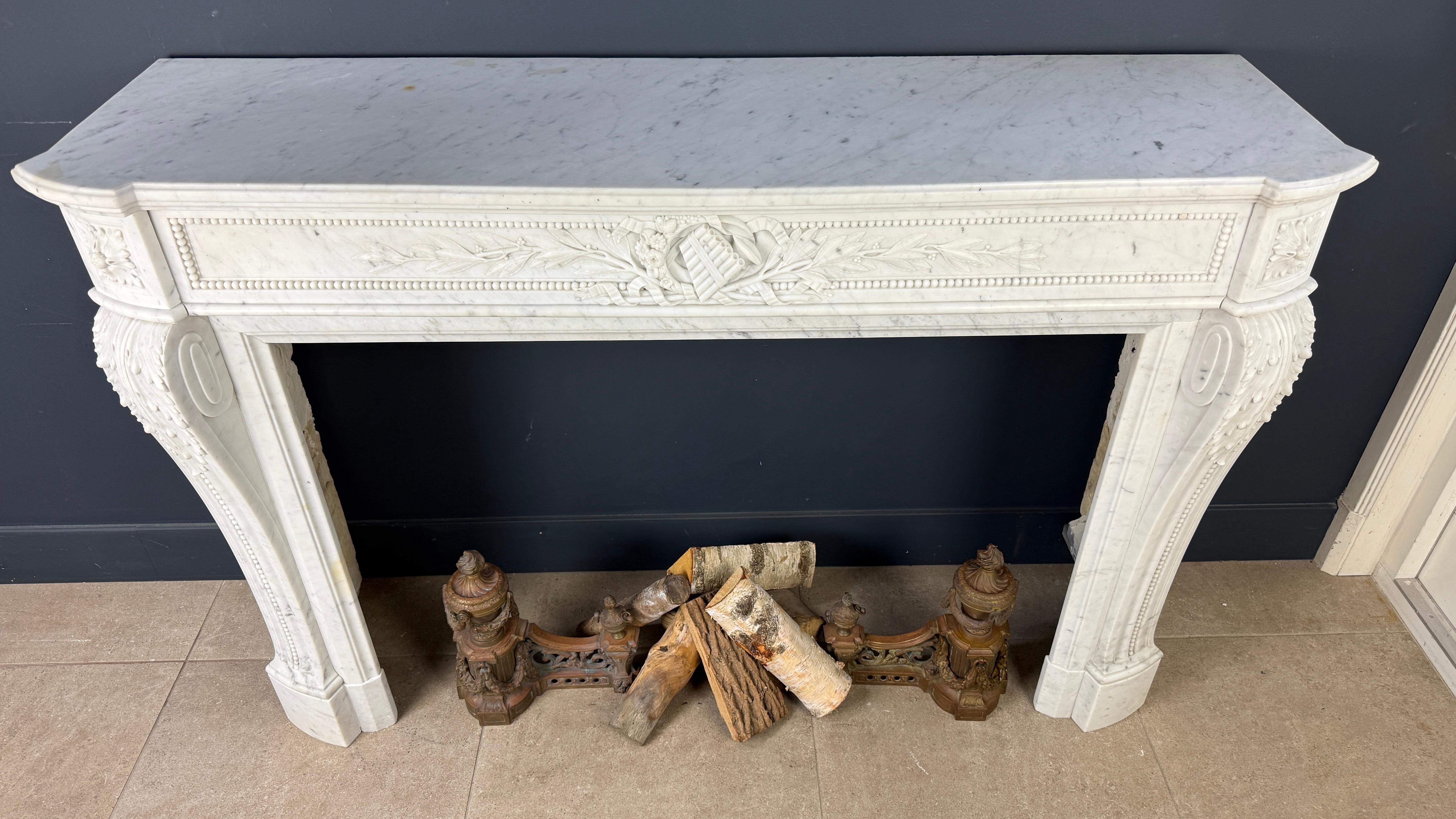 Hand-Carved Luxurious French Louis XVI Fireplace Mantel in Carrara Marble with Rich Ornament For Sale