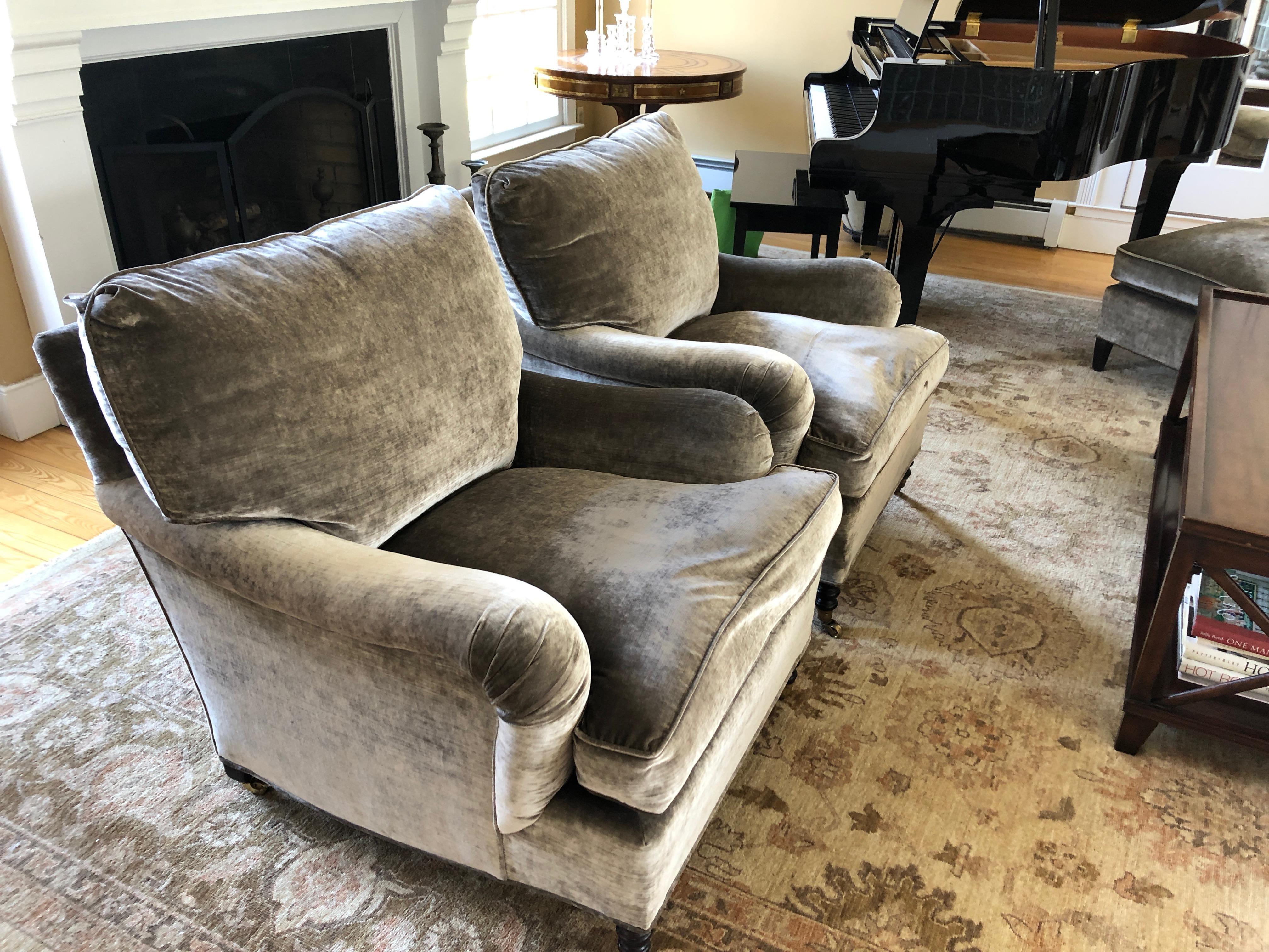 A luxurious pair of traditional Classic standard arm signature chairs with loose back cushion upholstered in grey velvet mohair and down filled. No label, but clients bought from George Smith and these were ordered with all the perks including the