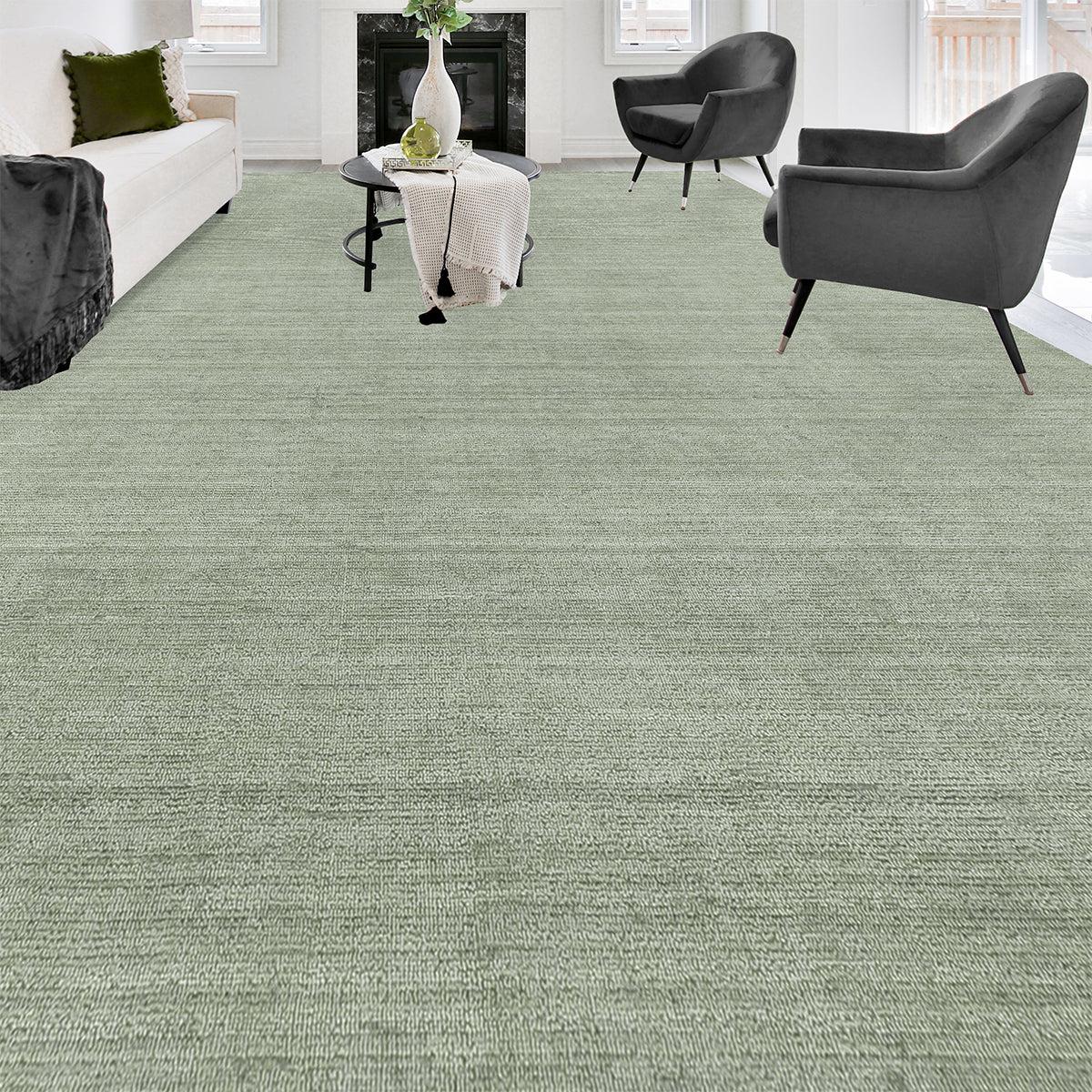 A subtle sense of texture is created by the high / low surface of this sophisticated collection of hand-loomed designs. This luxurious light green rug composed of the finest viscose, has a surface that is as soft to the hand as it is rich to the