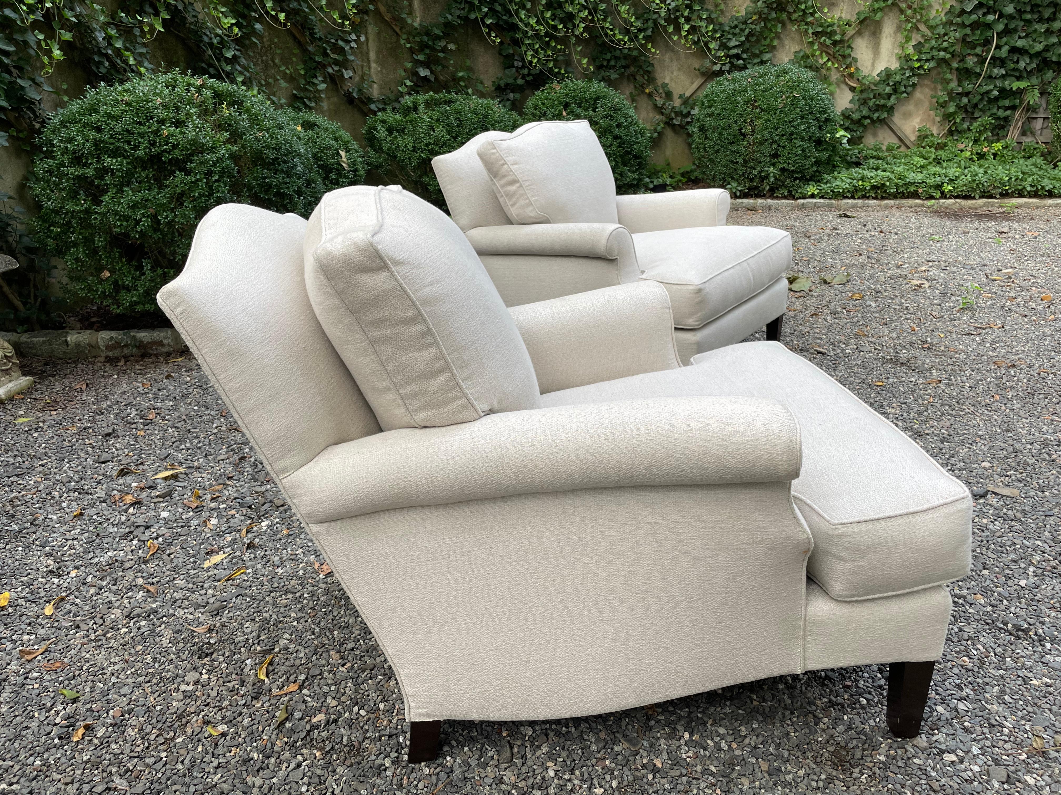 Luxurious and roomy pair of Nancy Corzine club lounge chairs referred to as the Hobbs chair. Linen and silk blend neutral upholstery, down wrapped removeable cushions and ebonized mahogany legs. The chairs retail for $4990 to the trade. arm height