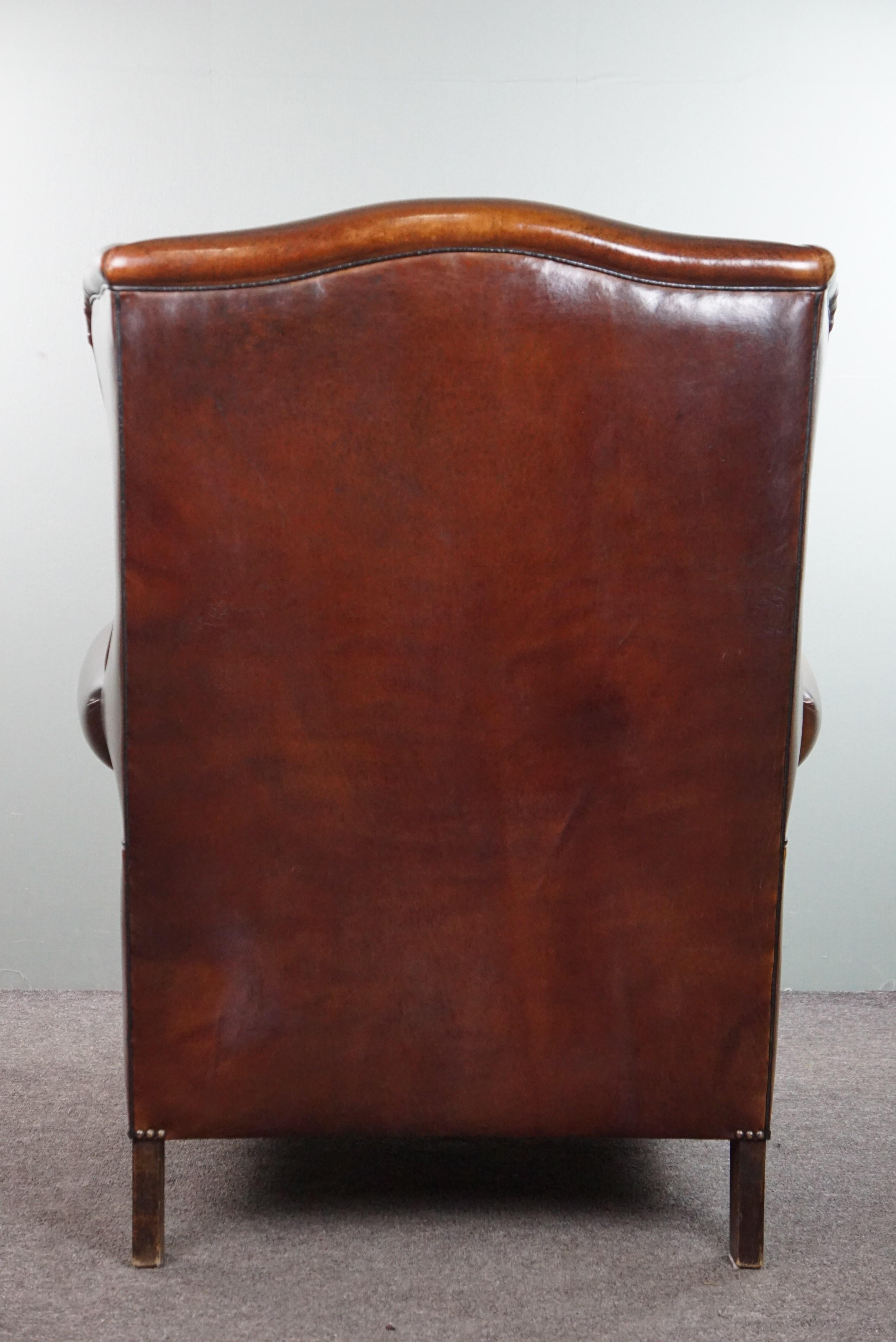 Late 20th Century Luxurious large sheep leather wingback armchair with beautiful colors and patina For Sale