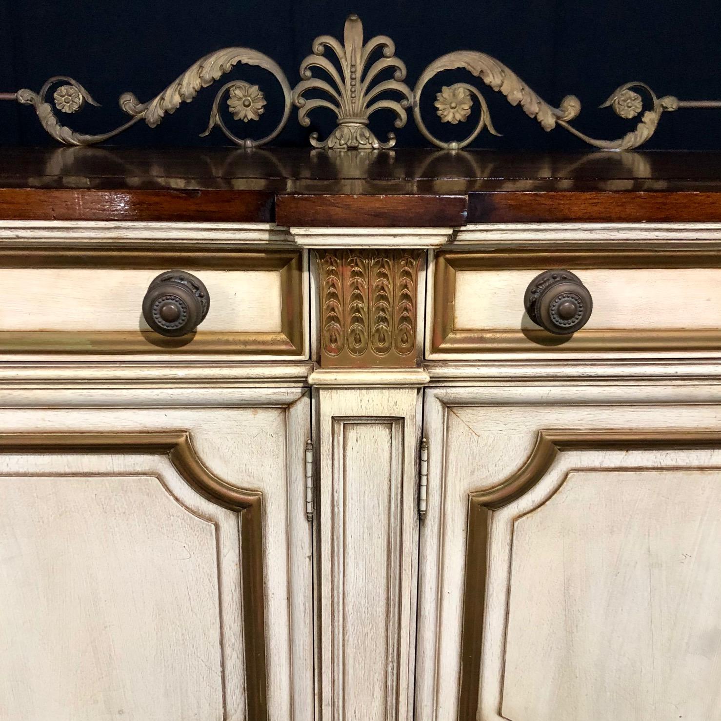 Classic Louis XVI 18th century style sideboard buffet having four drawers - two long and two short, with raised banded edges. The entire case sits on four splayed legs. Simple stepped cornice at the top. The finish is semi-glossy, and there is no
