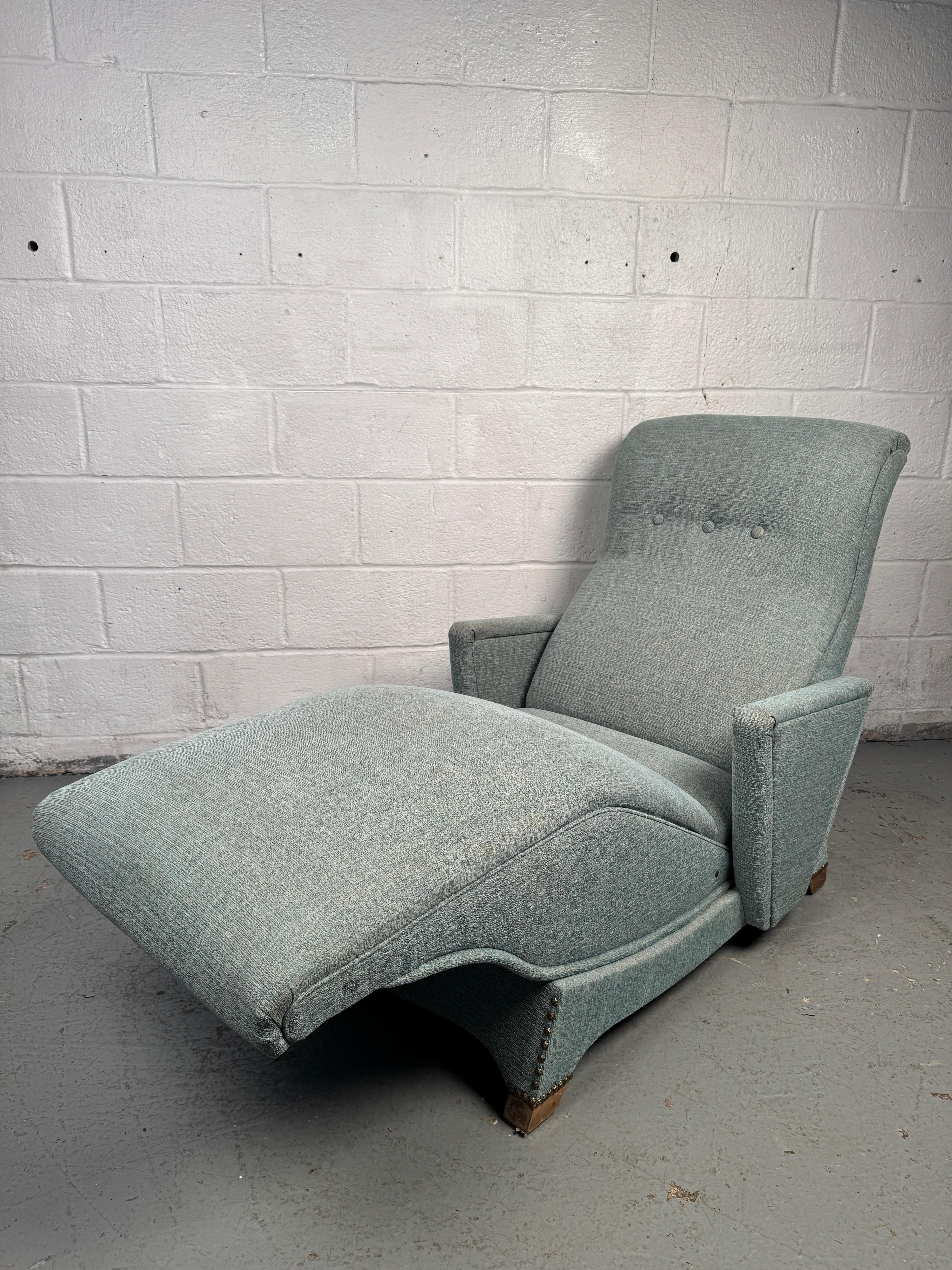 Elegant mid-century lounge chair with a sculptural frame and generously cushioned seat, designed for both comfort and style. Upholstered in rich fabric and accented by clean modern lines, this chair embodies the sophistication and relaxed elegance