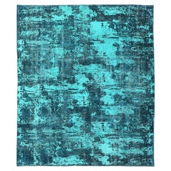 Lussuoso tappeto vintage dal design moderno con sfumature di blu, turchese, verde acqua e verde.