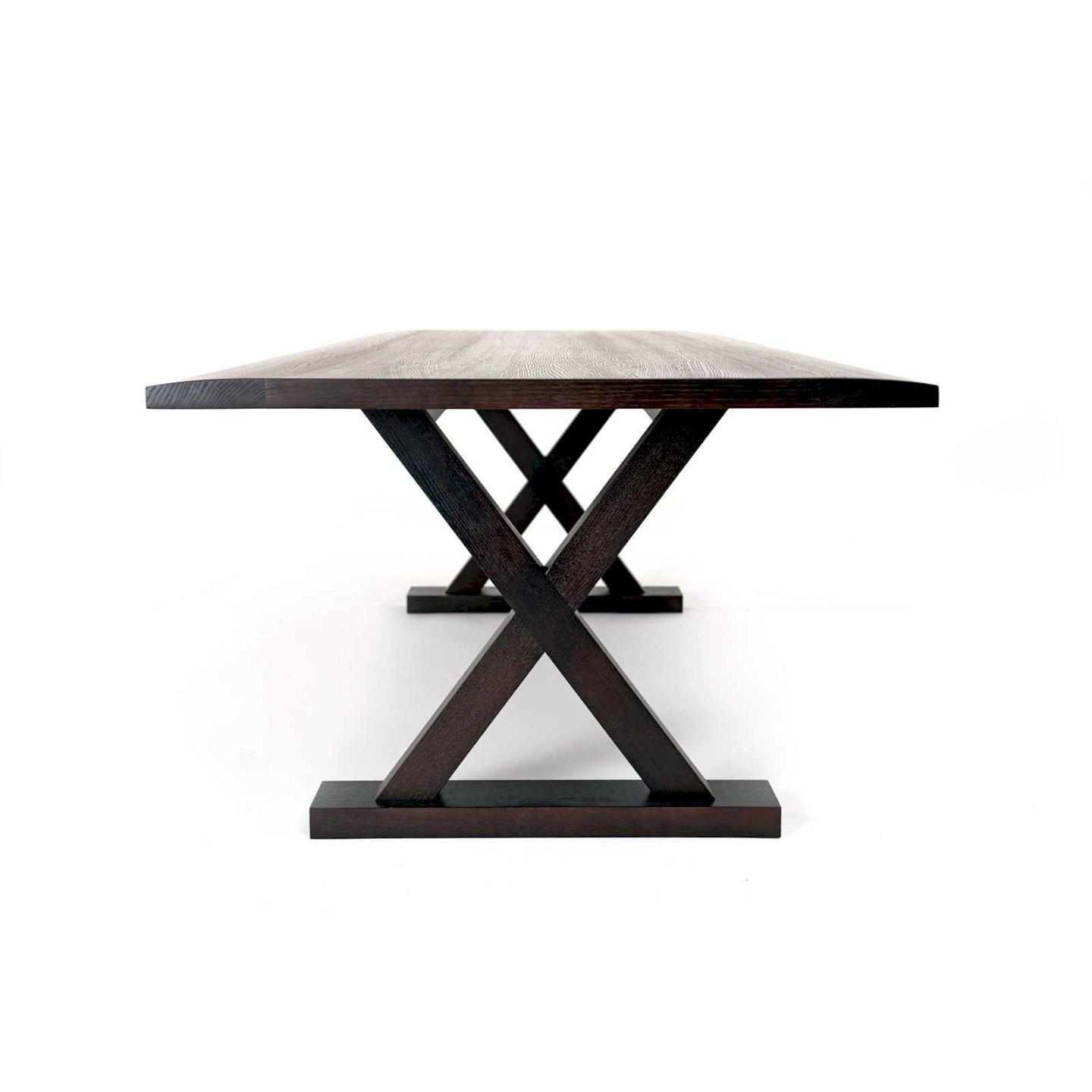 Showstopper ebonized oak Long Courrier table by Christian Liaigre. 
Ebonized oak top featuring unique curved edges, boasting striking wood veins on a trestle X-leg frame base. 
Retails for 14K
Proof of authenticity from Liaigre confirming this is