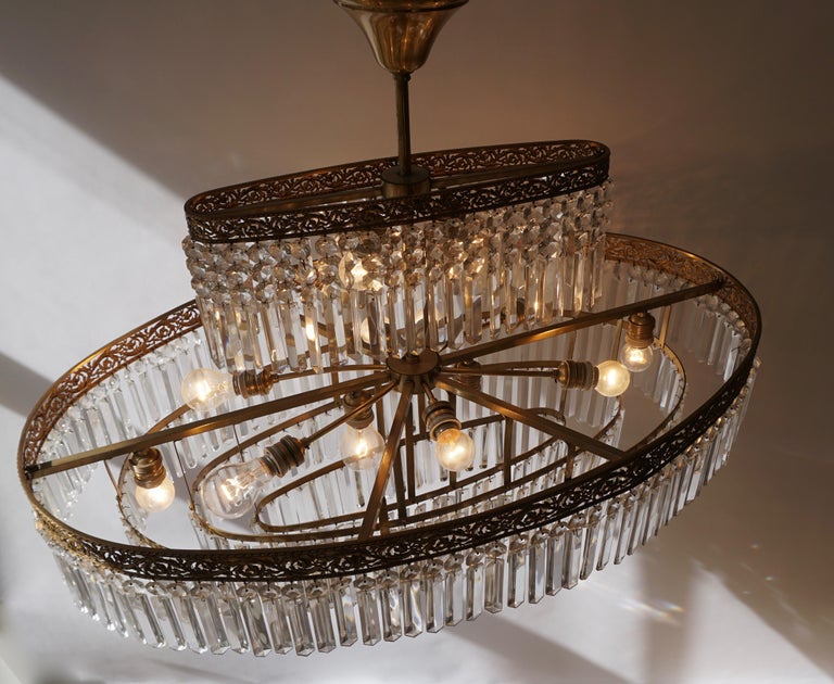 Luxurious Oval Shaped Crystal and Brass Hollywood Regency Chandelier at 1stDibs