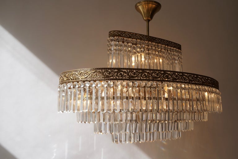 Luxurious Oval Shaped Crystal and Brass Hollywood Regency Chandelier at