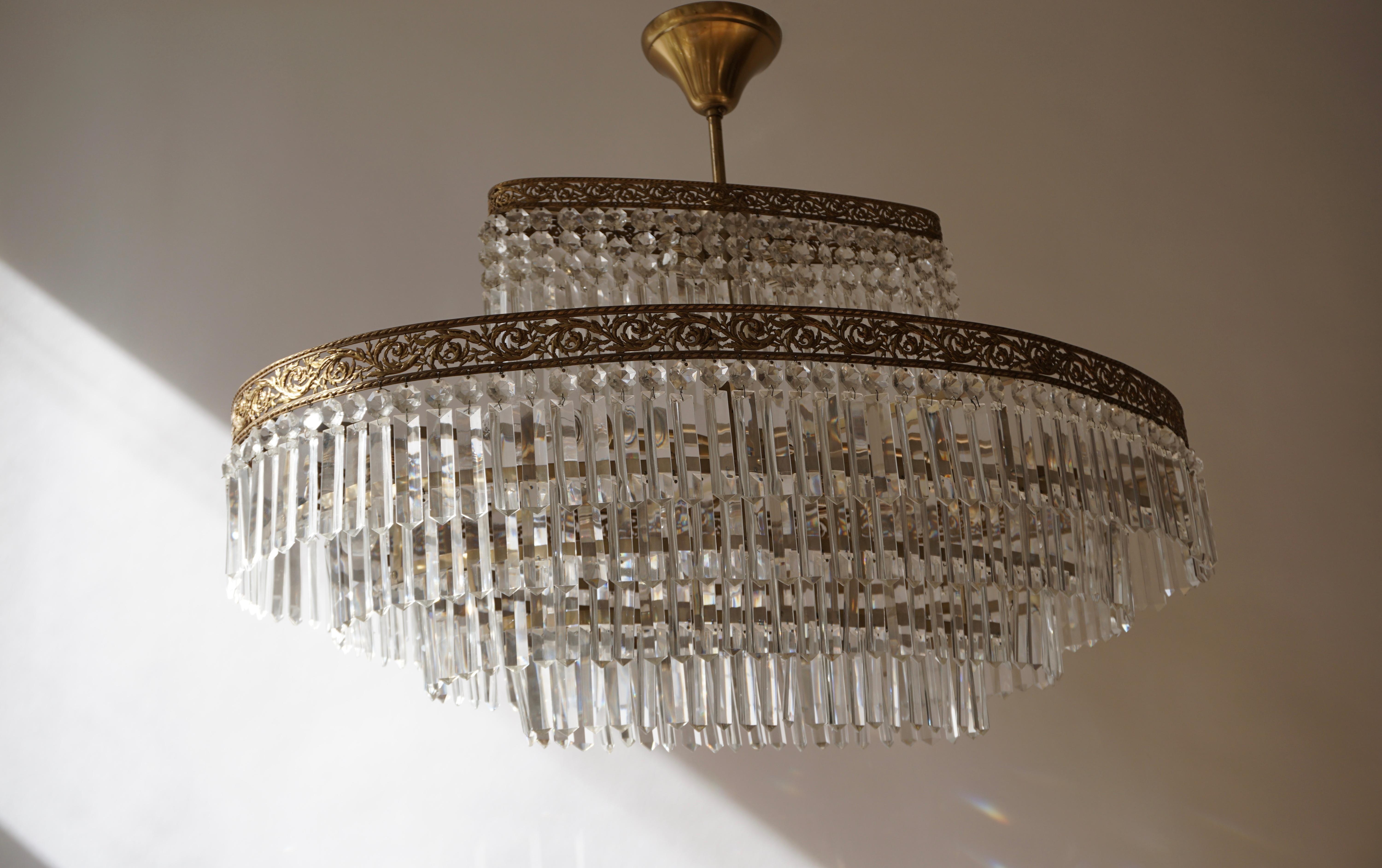 Italian Luxurious Oval Shaped Crystal and Brass Hollywood Regency Chandelier