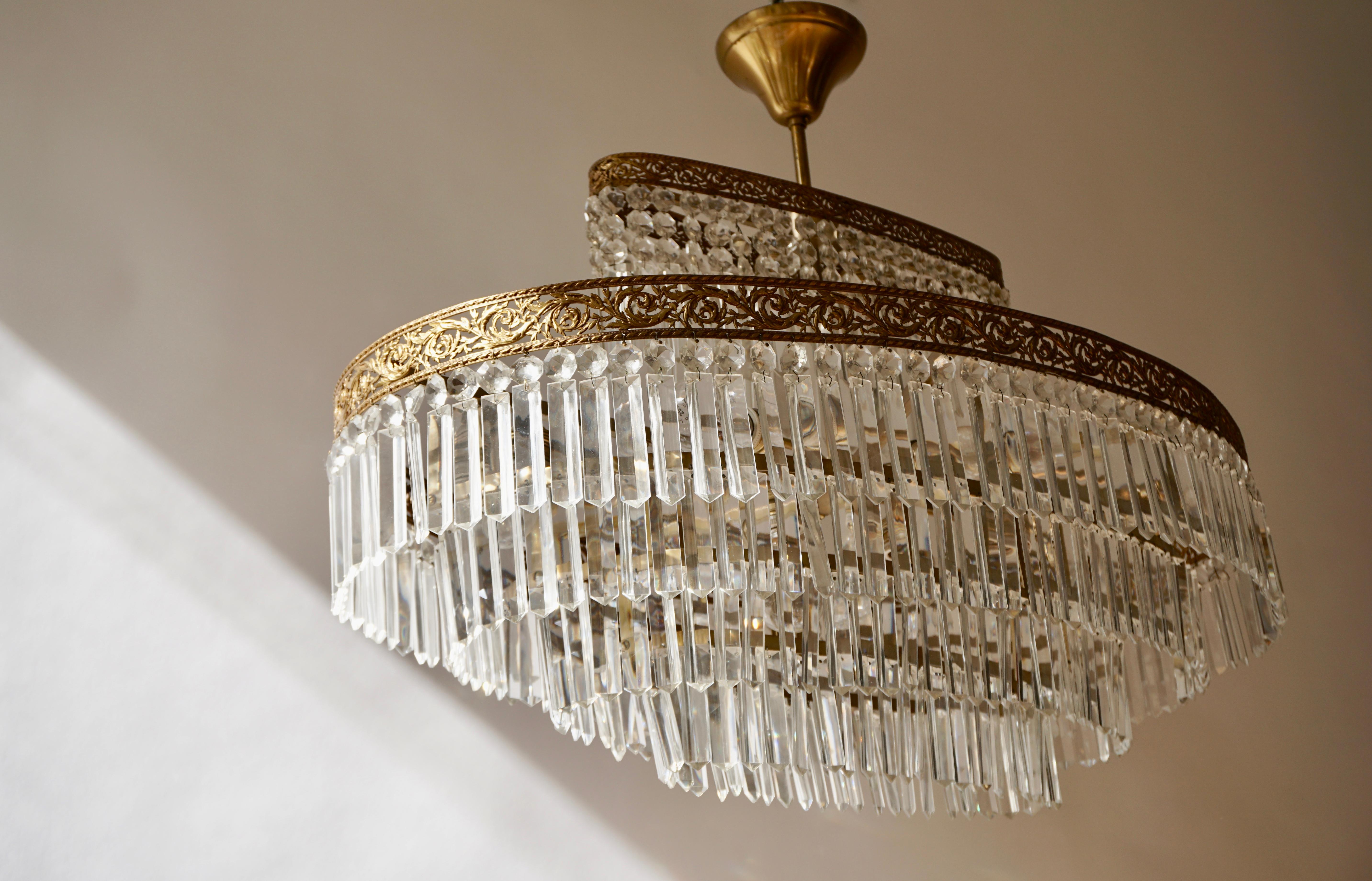 20th Century Luxurious Oval Shaped Crystal and Brass Hollywood Regency Chandelier