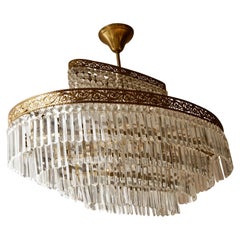 Luxurious Oval Shaped Crystal and Brass Hollywood Regency Chandelier