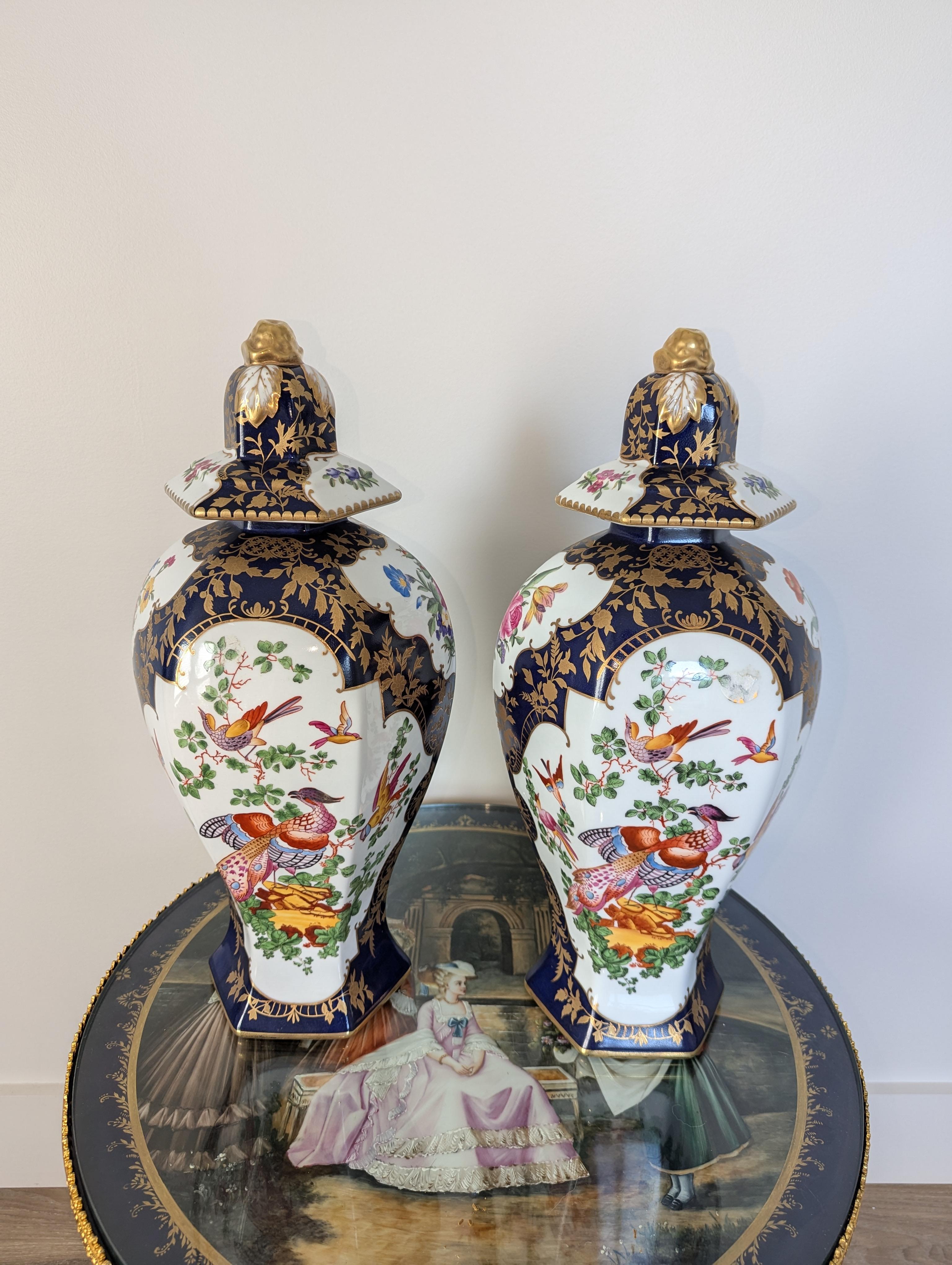 Elevate your home decor with these stunning Chelsea House peacock urns. Handcrafted with exquisite attention to detail, these luxurious vessels boast vibrant cobalt blue and floral gilt hues, evoking the majesty of the peacock. Standing tall at 20