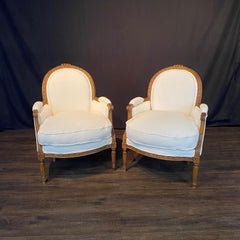 Luxurious Pair of French Louis XVI Carved Walnut Armchairs Bergere Chairs