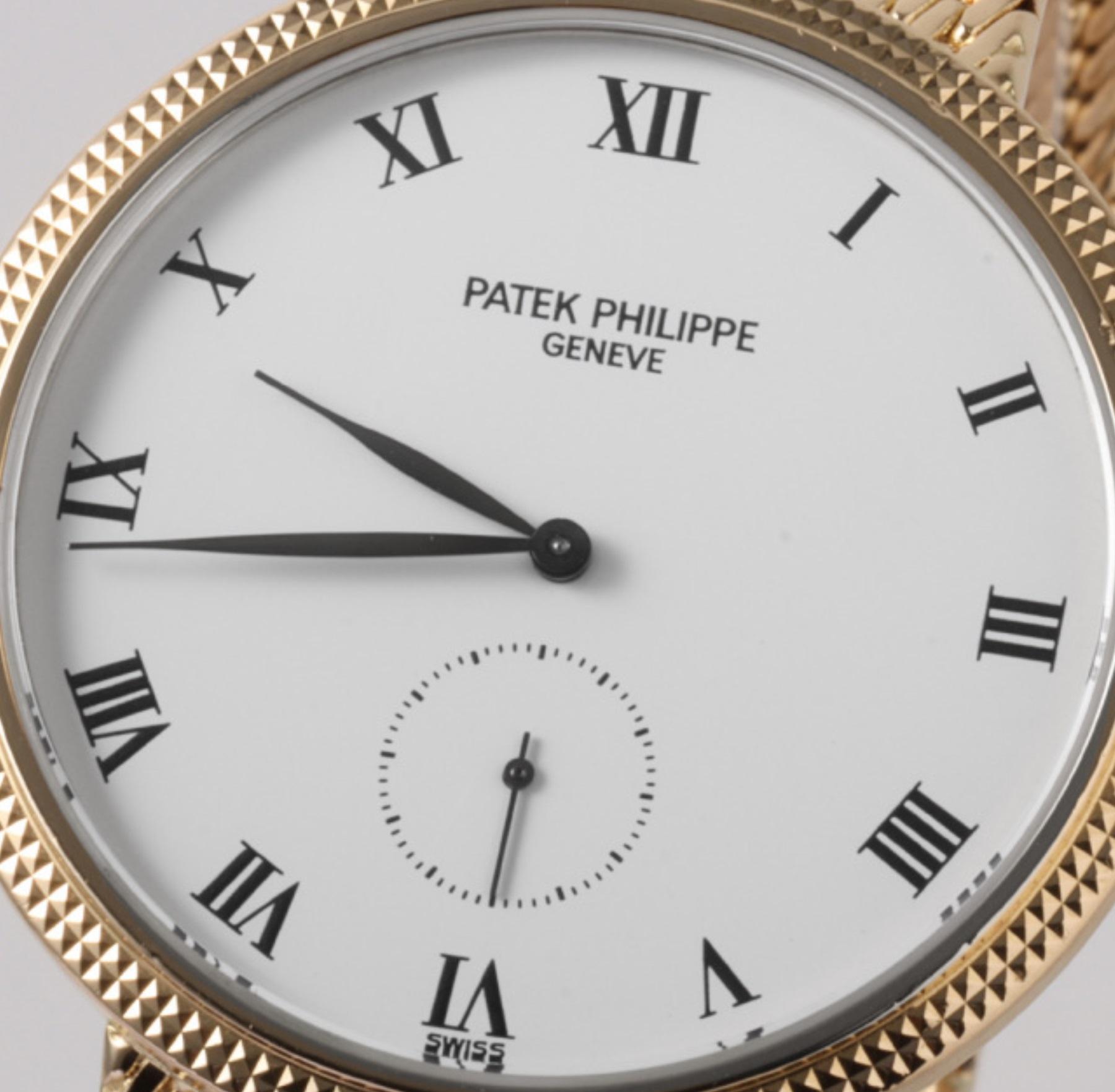 Luxurious Patek Philippe Calatrava 3919/5J Men's Watch - Pre-Owned Gold In Good Condition For Sale In Holtsville, NY