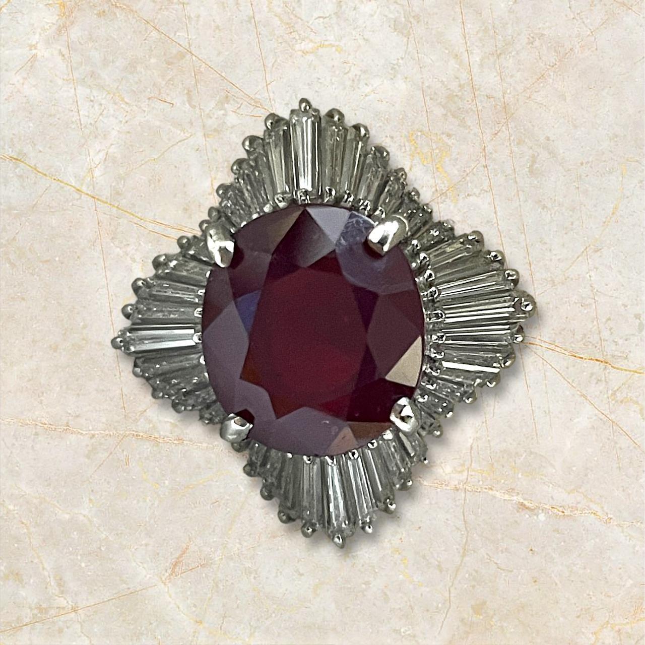 Experience the pinnacle of luxury with this stunning platinum ring, featuring a breathtaking 8.08-carat ruby at its center. Surrounded by a radiant 1.84-carat diamond halo, this exquisite piece captures the essence of elegance and sophistication,