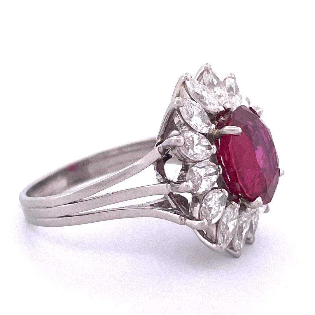 Luxurious Platinum Ruby and Diamond Ring

Indulge in luxury with this exquisite platinum ring featuring a captivating center oval-shaped ruby weighing 4.01 total carats, elegantly encircled by a dazzling array of marquise-cut diamonds weighing 3.5