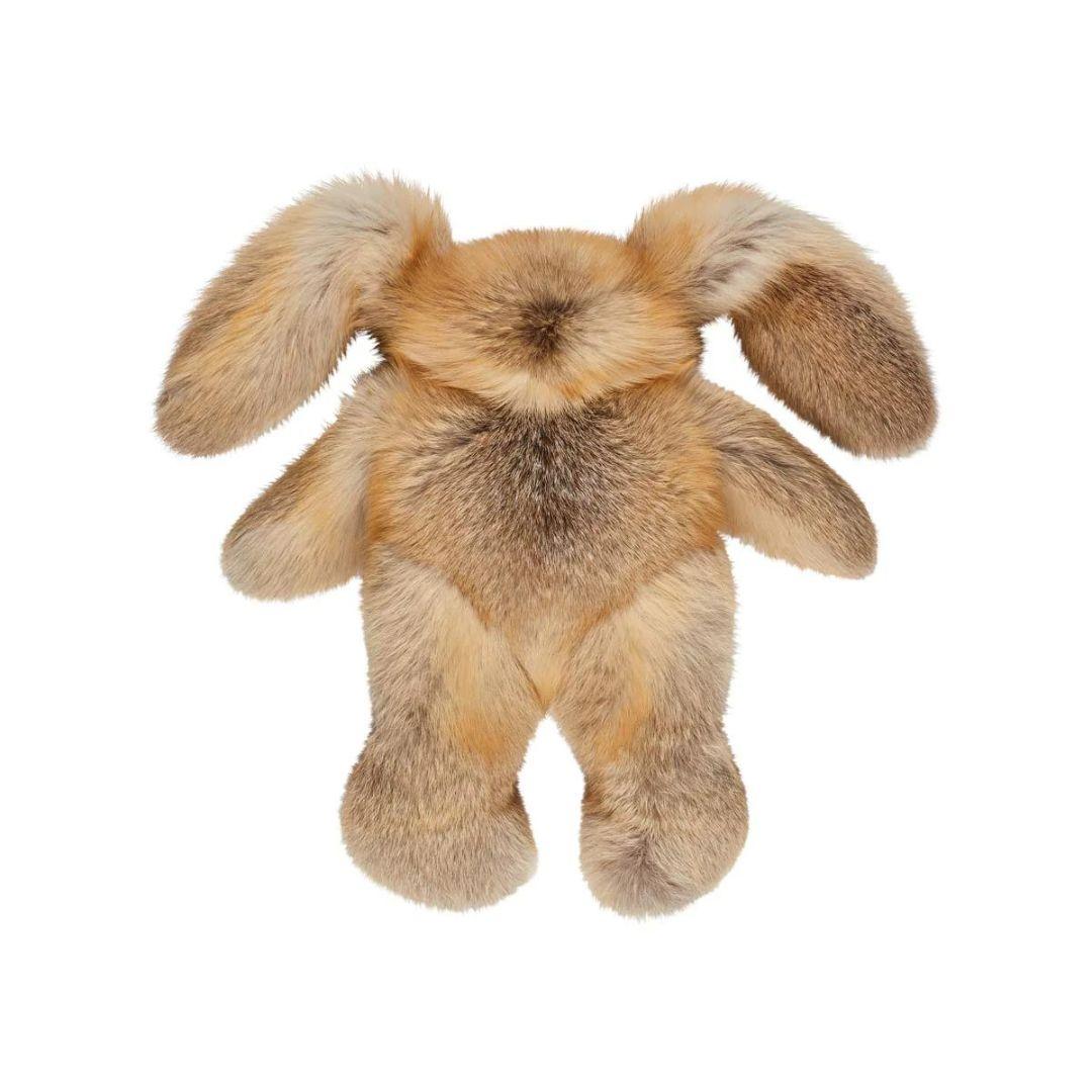 Introducing an extraordinary piece that transcends the boundaries between plush toy and sculptural art: our meticulously crafted rabbit teddy bear, fashioned from genuine Finnish gold fox fur. This opulent creation stands as a testament to the