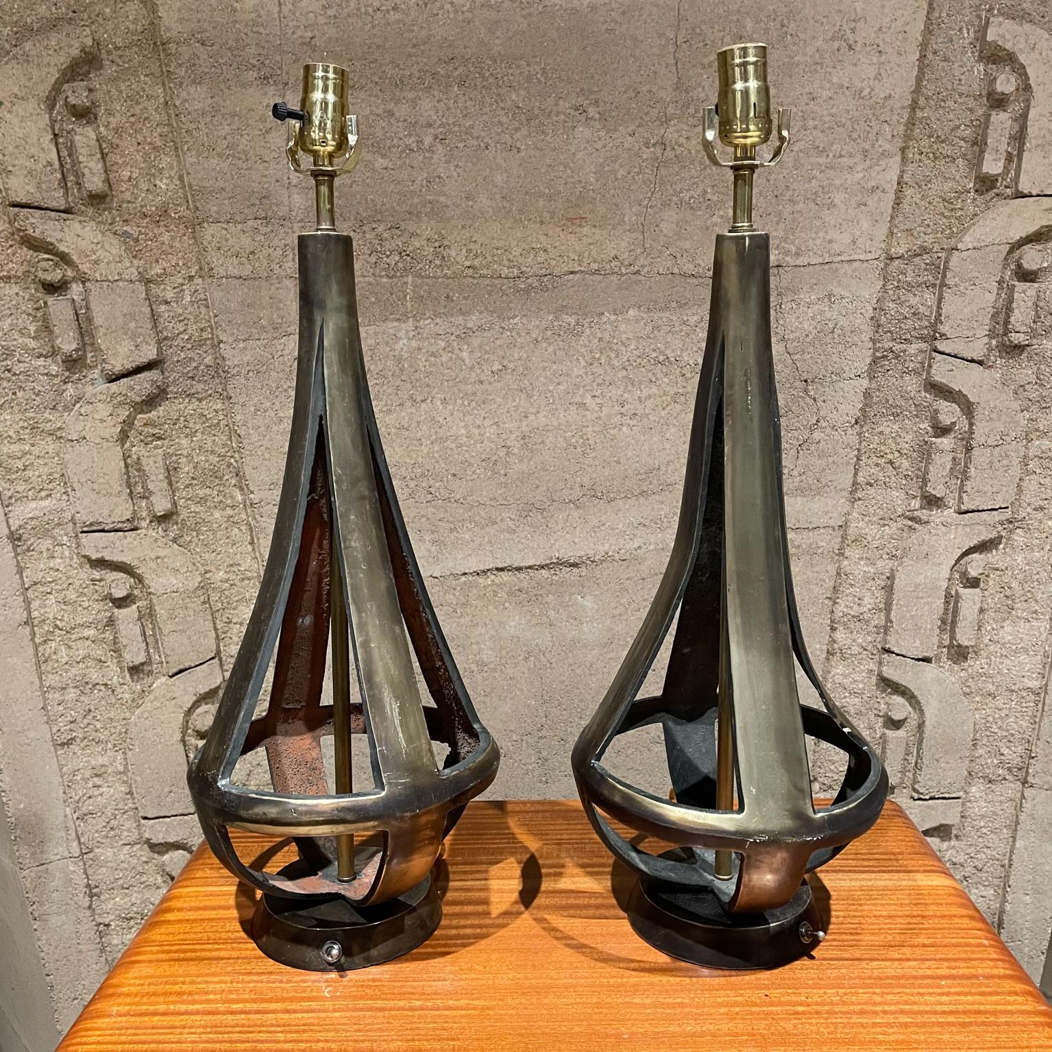 Table lamps
Sensational sculptural two-tone bronze table lamps by Arturo Pani Mexico 1950s.
 Unmarked.
Measures: Height 24.75 in. x Diameter 9.25 in.
The lamps have been rewired with silk cord. Brass has been polished. 
Shades are not included