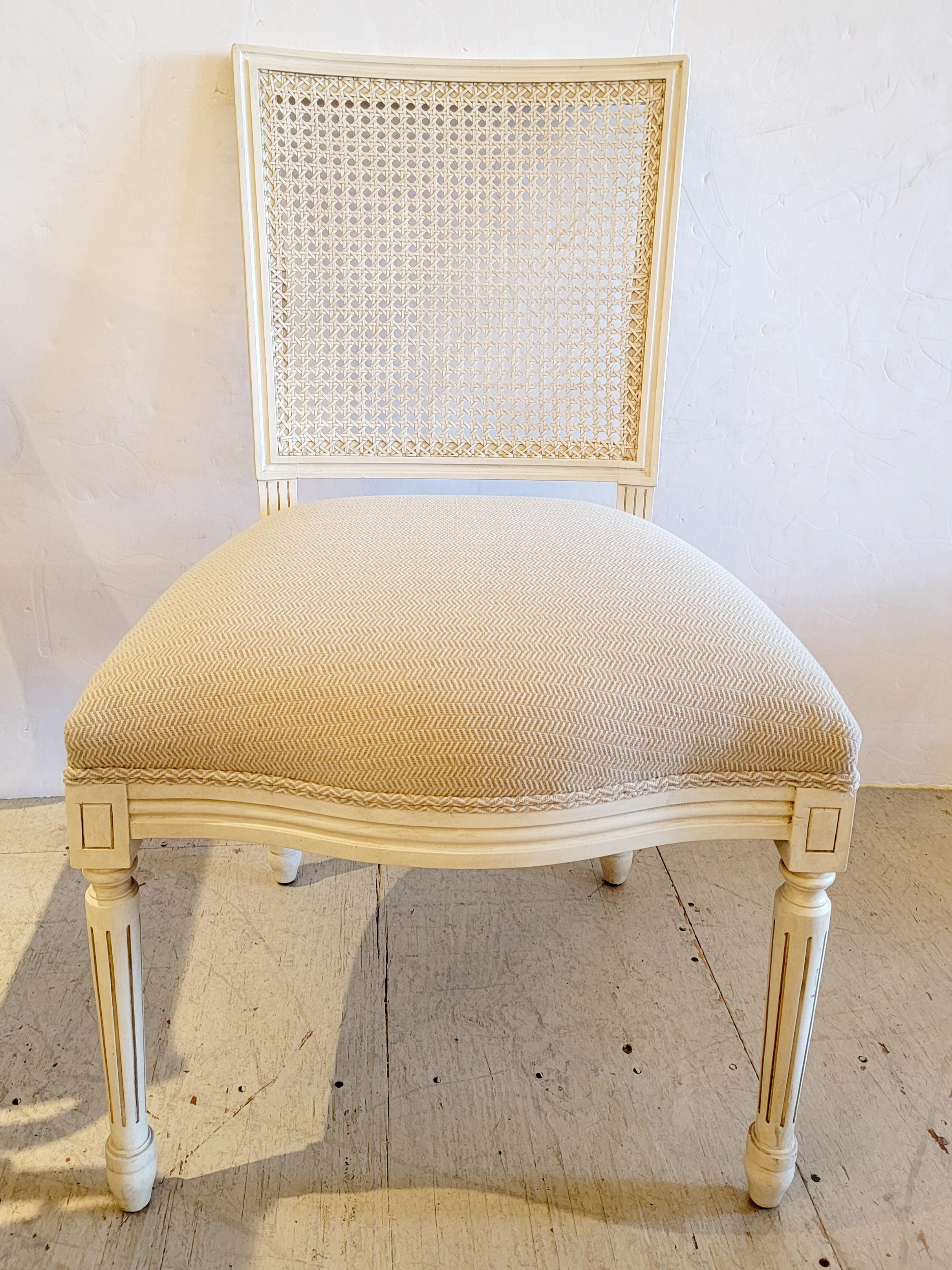 Stunning luxurious set of 4 carved painted wood side dining chairs in a neutral cream and having upholstered cream on cream herringbone seats. Roomy and substantial, very elegant chairs.