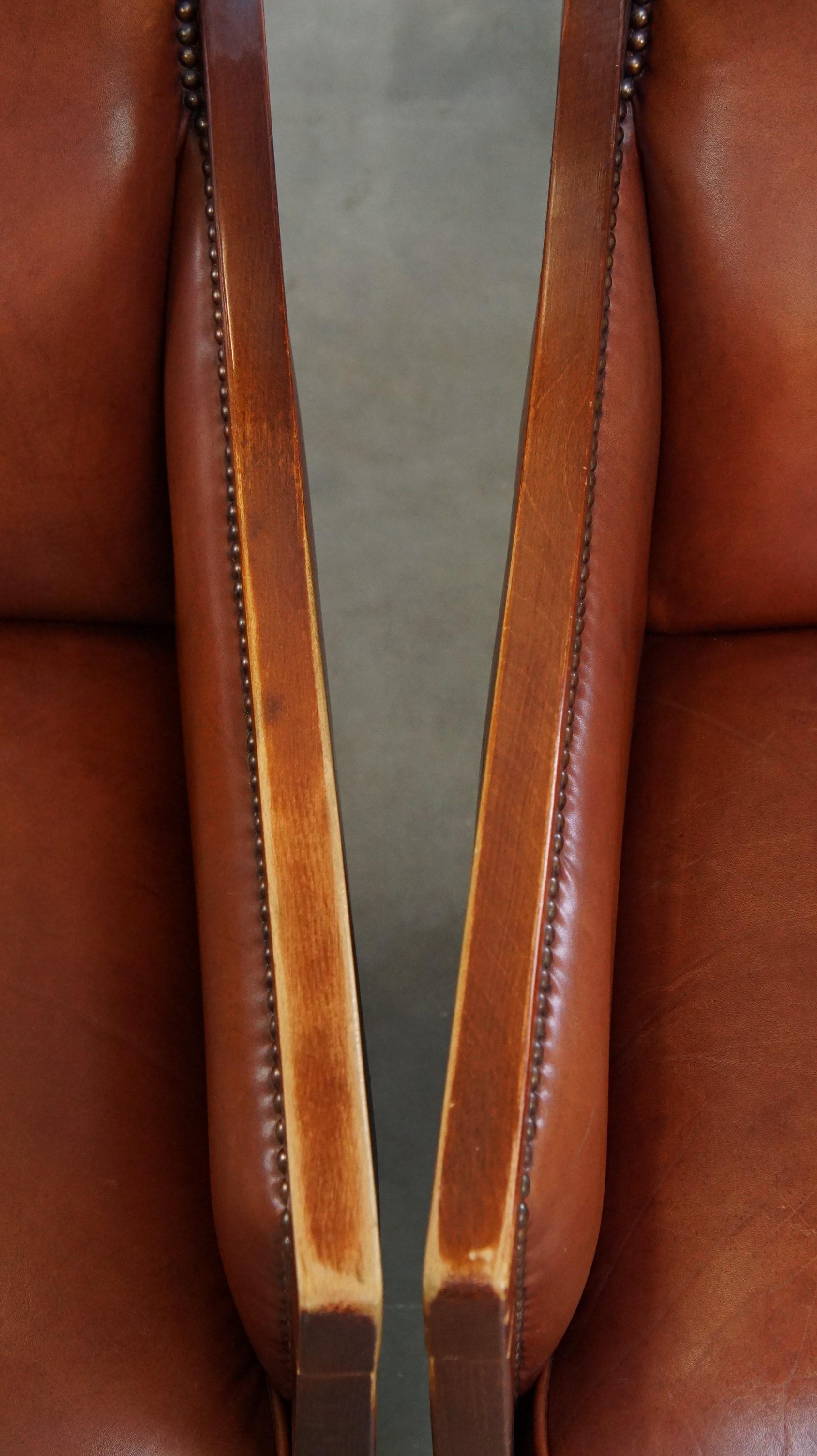 Lussuoso, maestoso, set di 2 poltrone in pelle di mucca color cognac dal design Art Deco in vendita 1