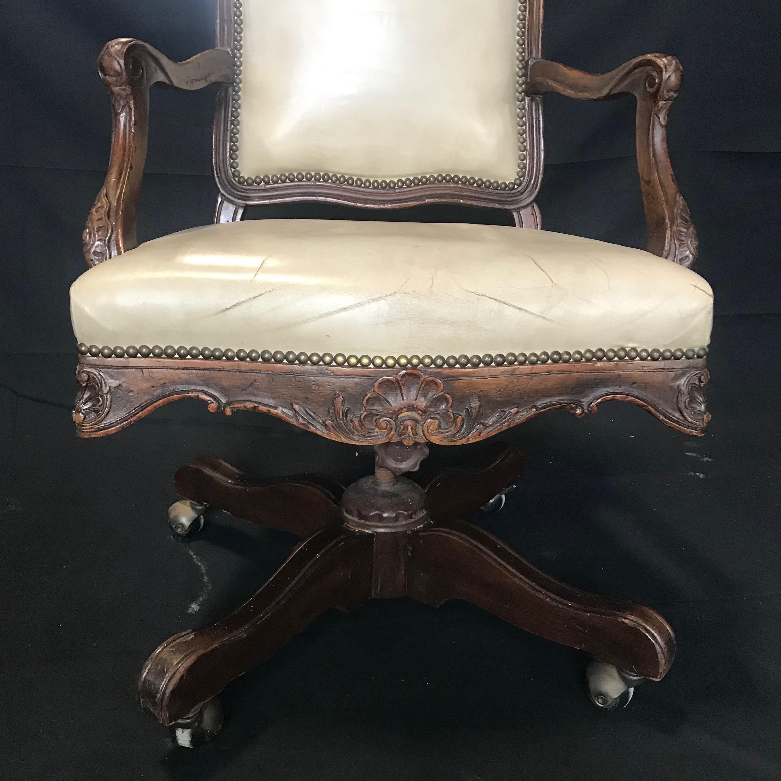 Beautiful early 20th century Louis XV style oak desk chair with ivory leather. Great shape and on casters. Spins!
 
Measures: H seat 18.5”
H arm 27”
#2012.