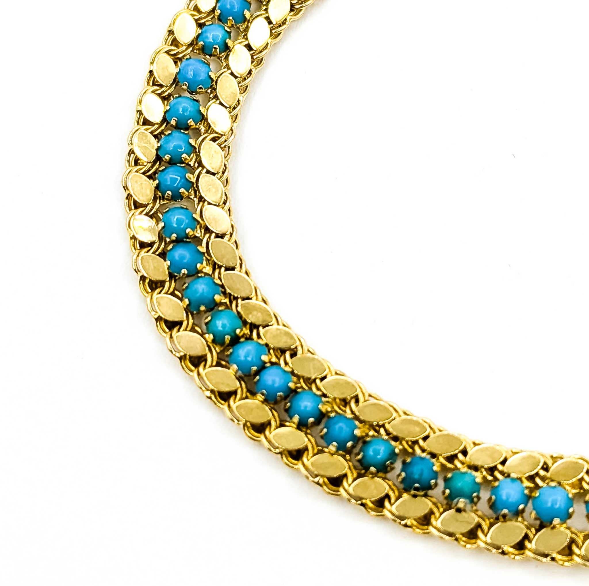 Ce bracelet en or jaune 18 carats est orné d'une turquoise sertie et d'un maillage de maillons.

Le bracelet mesure environ 7,5 pouces. Les dimensions supplémentaires sont d'environ 8 mm et le poids est de 12,00 grammes. La turquoise, pierre de