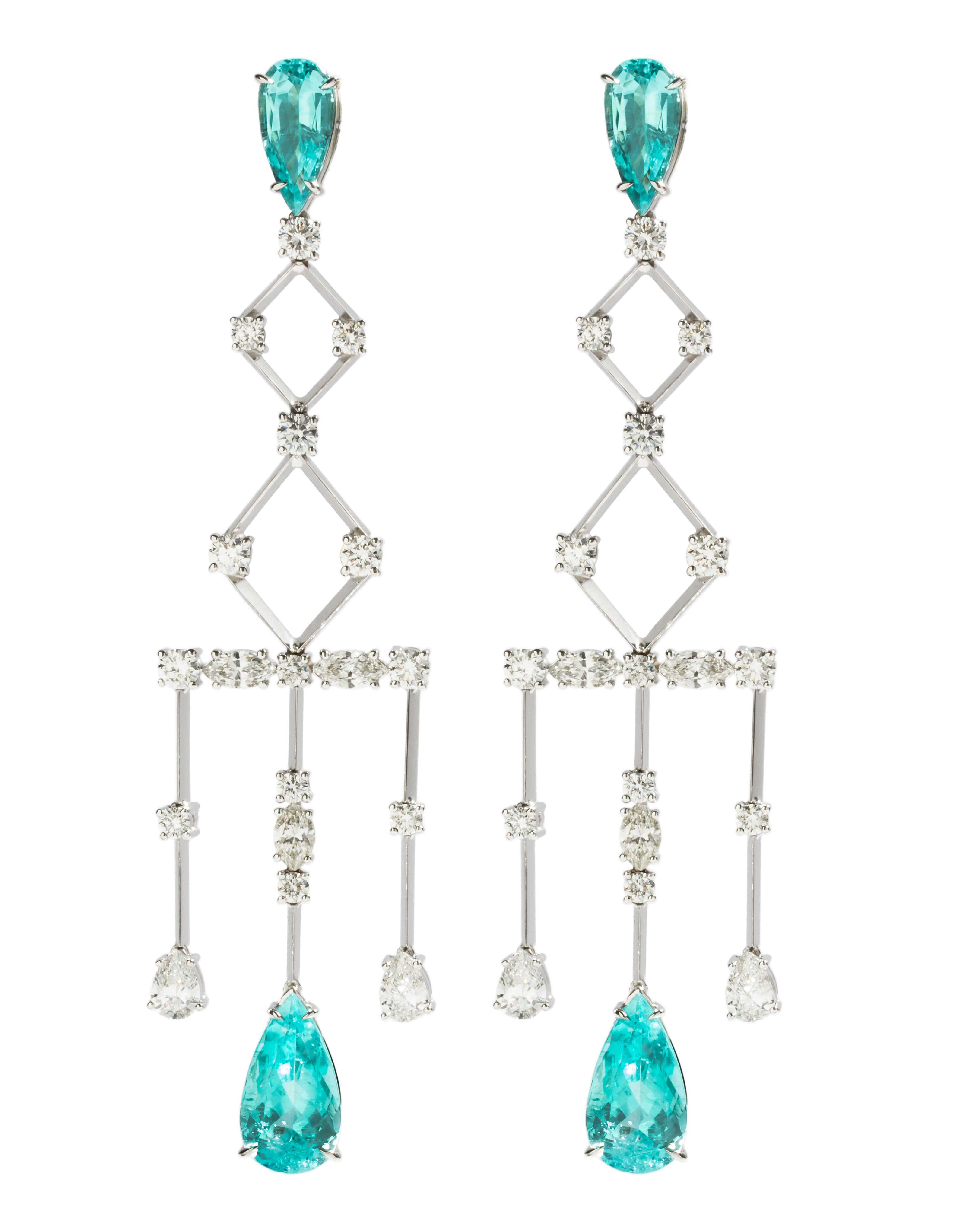 Designed exclusively by Ara Vartanian, these 18 Karat White Gold Chandelier Earrings feature four pear-shaped modified brilliant Paraiba Tourmalines totalling 12.22 Carat as well as four pear-shaped modified brilliant White Diamonds totalling 1.25