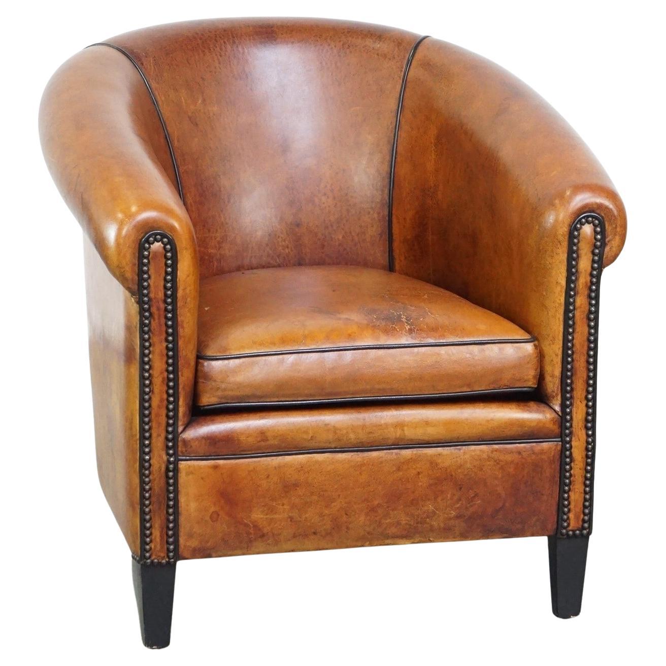 Luxuriously designed vintage sheep leather club armchair with a premium finish