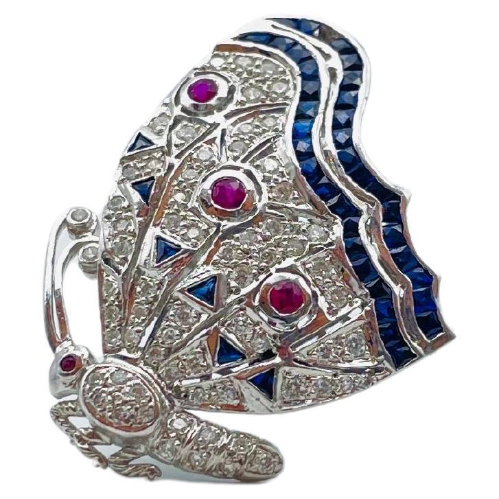 Prepare to be enchanted by the sheer opulence and charm of this breathtaking 18-karat white gold brooch, crafted in the form of a magnificent butterfly. The beauty and meticulous attention to detail in this stunning creation defy mere words.