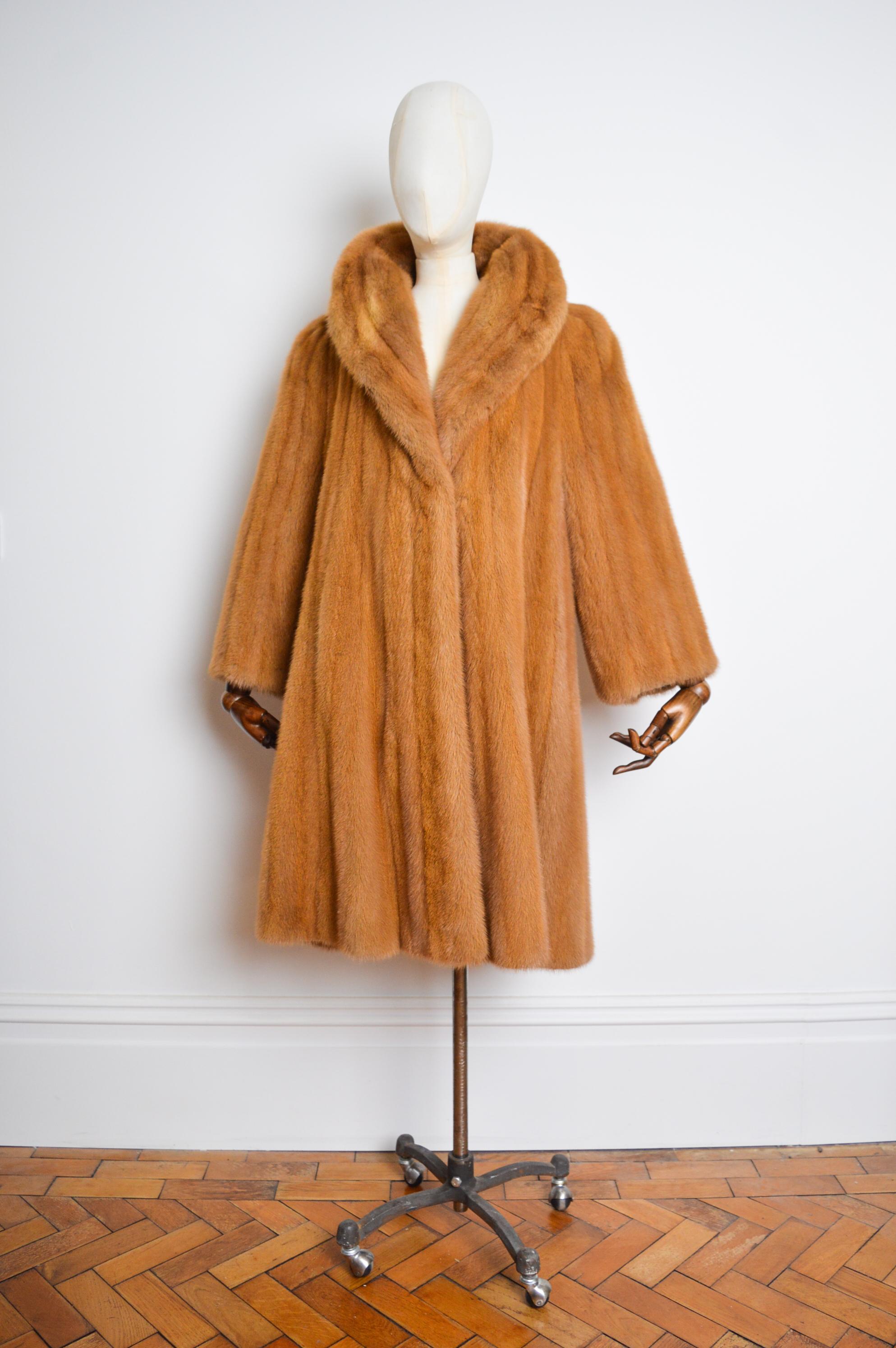 This exceptional Vintage Fur Jacket comes in a Highly Unusual 'Ginger' coloured shade and features extremely Plush, thick Pelts of soft Natural Mink, Paisley Lined interior, central farrier hook fasten closure and a loose, slouchy fit that can be