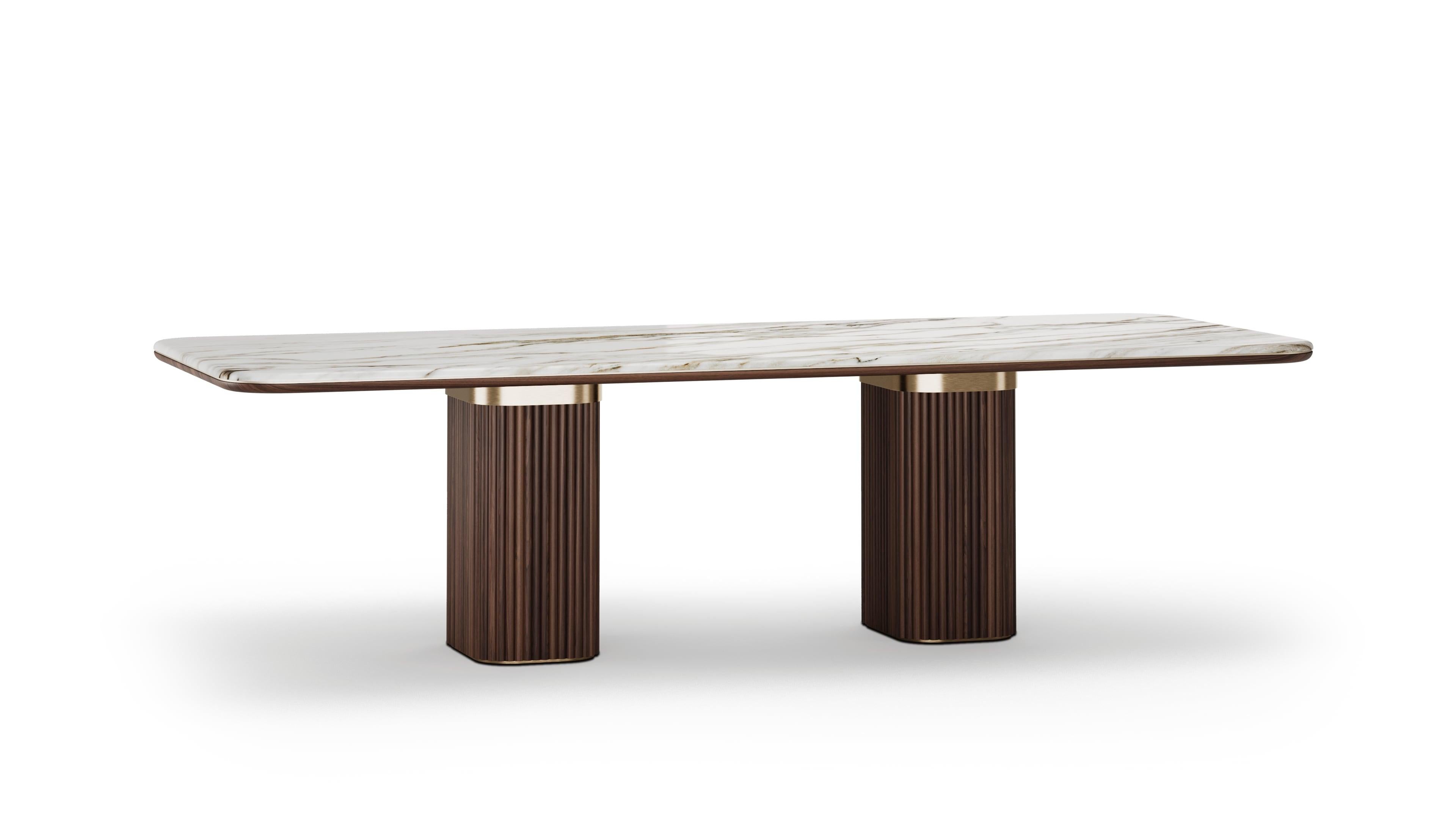Doran dining table is a compact yet luxurious statement piece, combining rich walnut wood with refined materials.The tabletop is finished in exquisite Calacatta Gold marble, introducing veined elegance and natural beauty. Perfect for intimate dining