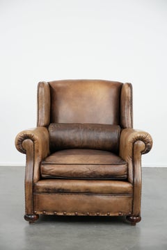 Luxury and large cowhide leather wingback chair in English style