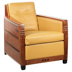 Luxury and well-maintained yellow Art Deco design armchair